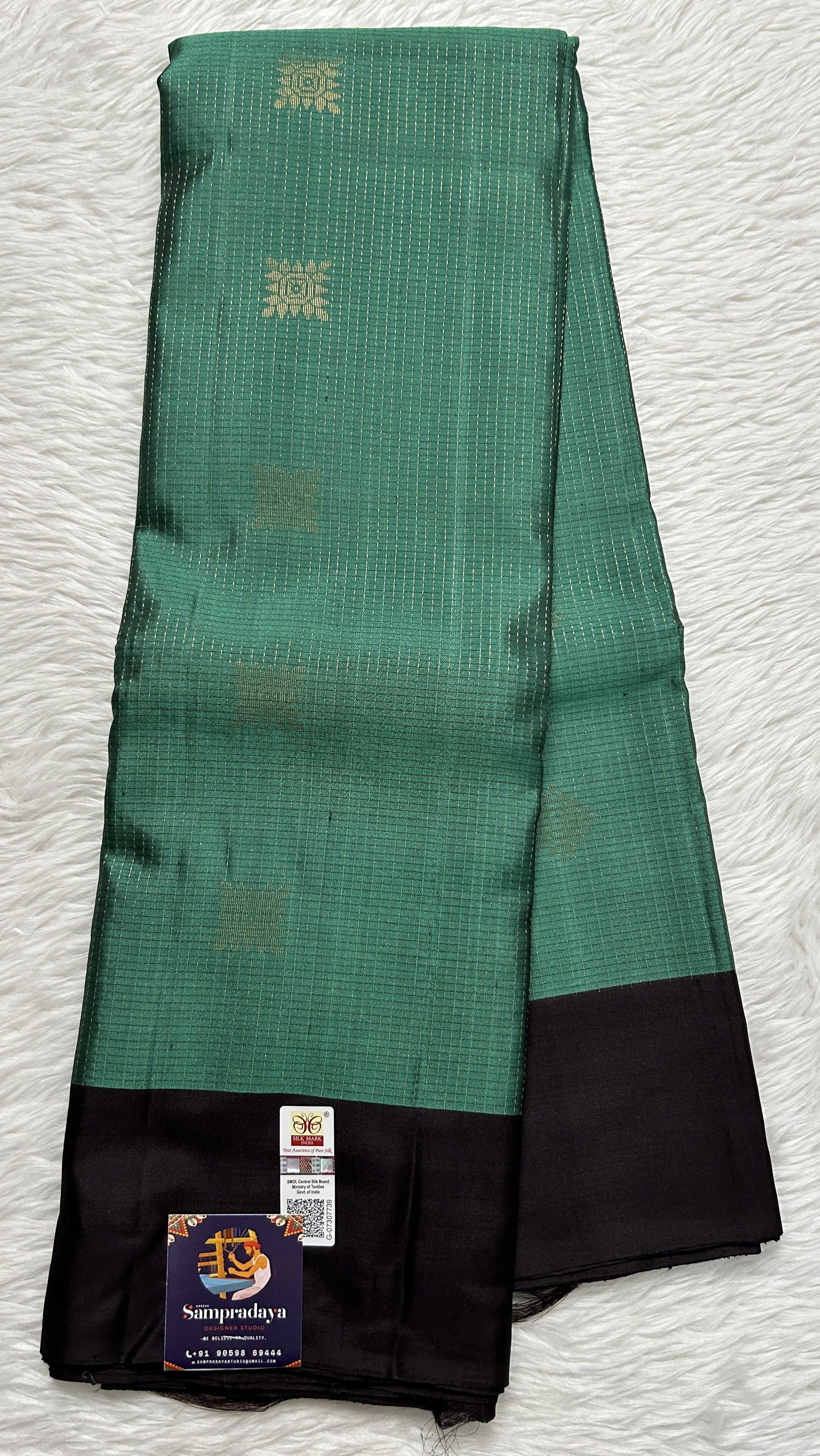 Kanjivaram Festive Soft Silk Saree Bottle Green colored complemented with a Brown Colored Plain border. - Sampradaya Designer Studio