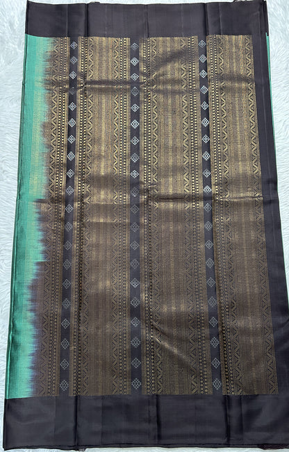 Kanjivaram Festive Soft Silk Saree Bottle Green colored complemented with a Brown Colored Plain border. - Sampradaya Designer Studio