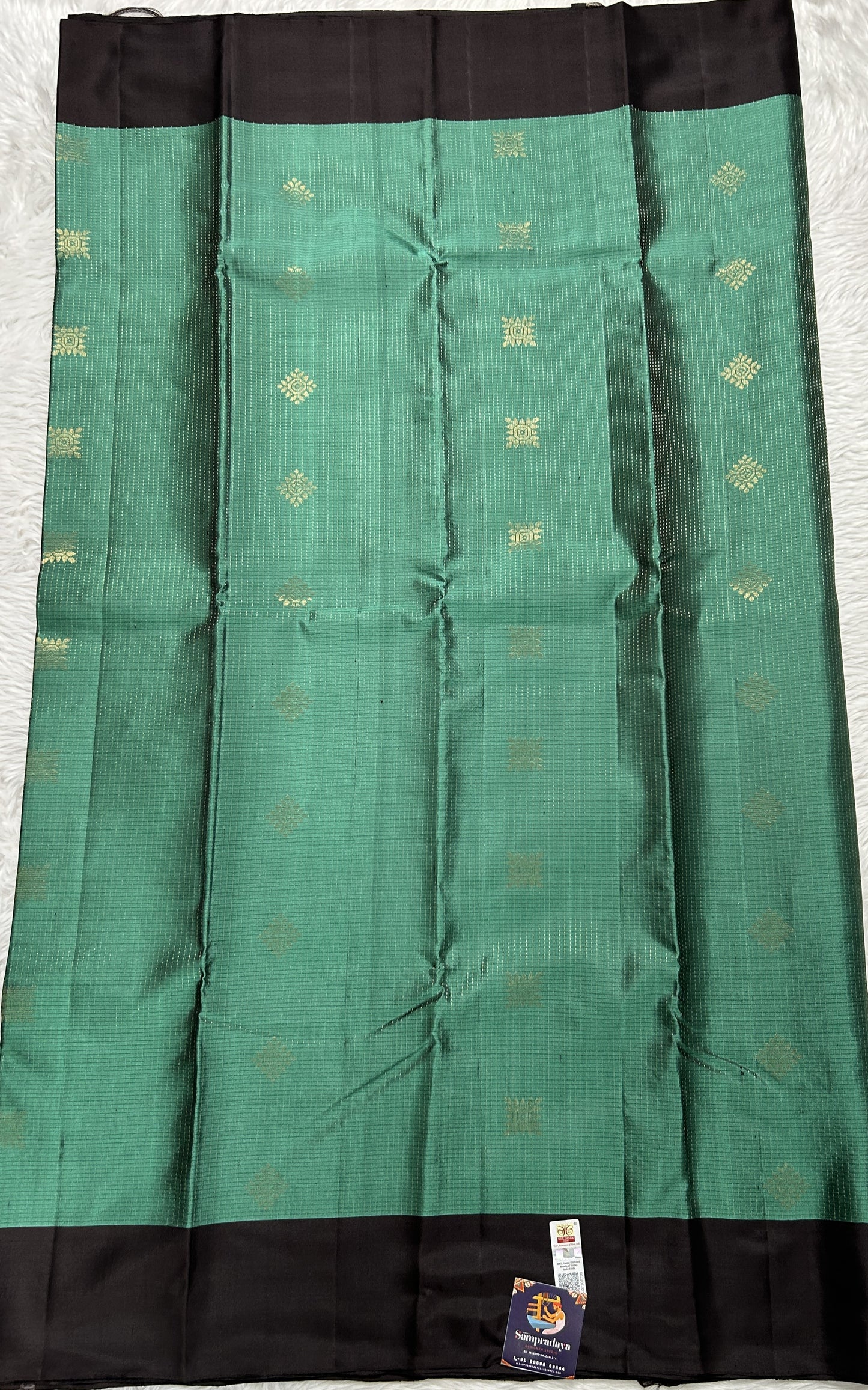 Kanjivaram Festive Soft Silk Saree Bottle Green colored complemented with a Brown Colored Plain border. - Sampradaya Designer Studio