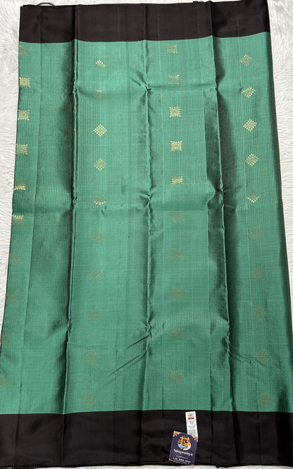 Kanjivaram Festive Soft Silk Saree Bottle Green colored complemented with a Brown Colored Plain border. - Sampradaya Designer Studio