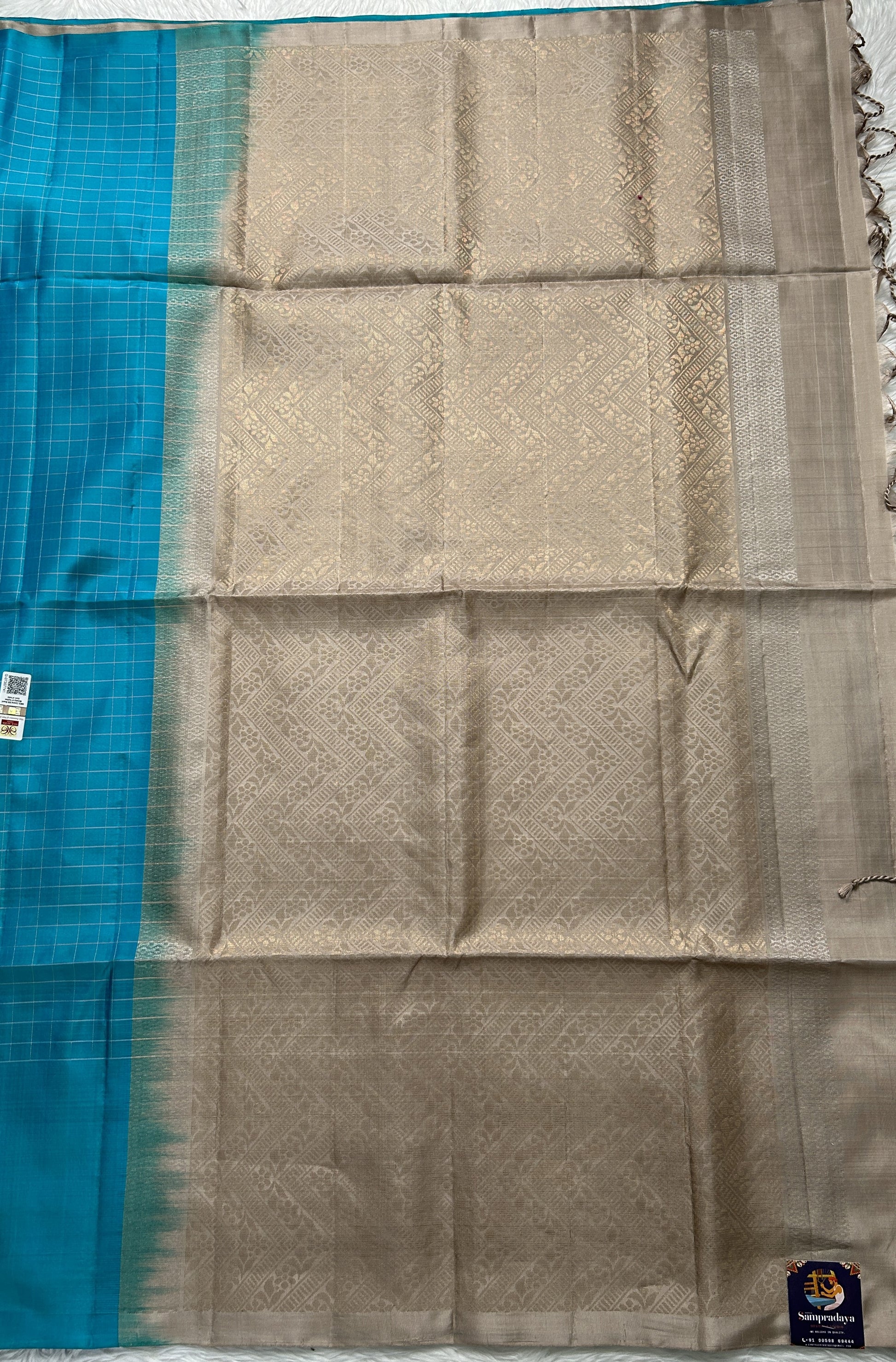 Kanjivaram Festive Soft Silk Saree Blue colored complemented with a Cream Colored Kanchi border. - Sampradaya Designer Studio