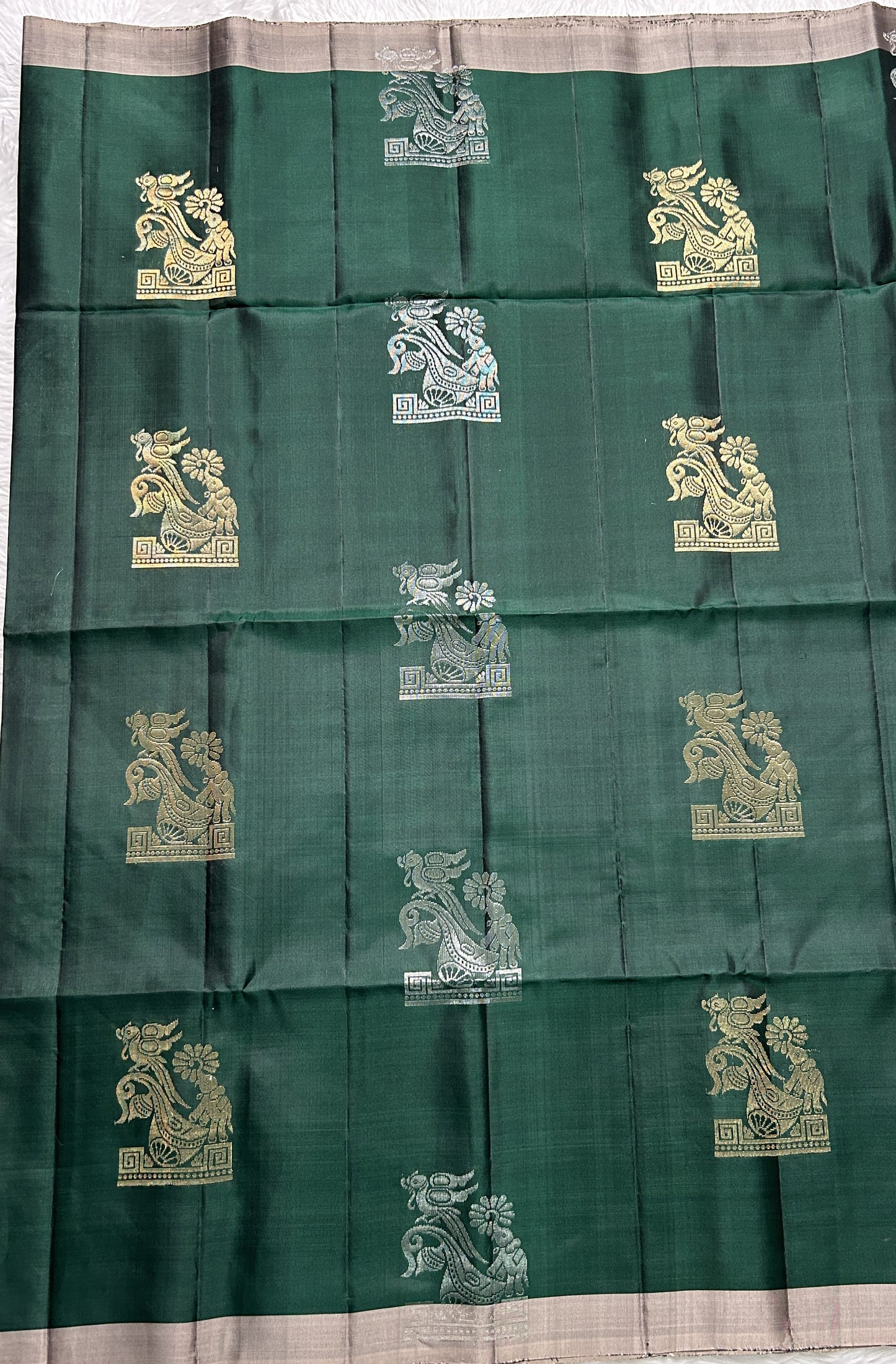 Kanjivaram Festive Soft Silk Saree Bottle Green colored complemented with a Cream Color Plain border. - Sampradaya Designer Studio