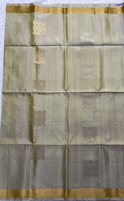 Kanjivaram Festive Soft Silk Saree Light Green colored complemented with a Gold Zari border. - Sampradaya Designer Studio