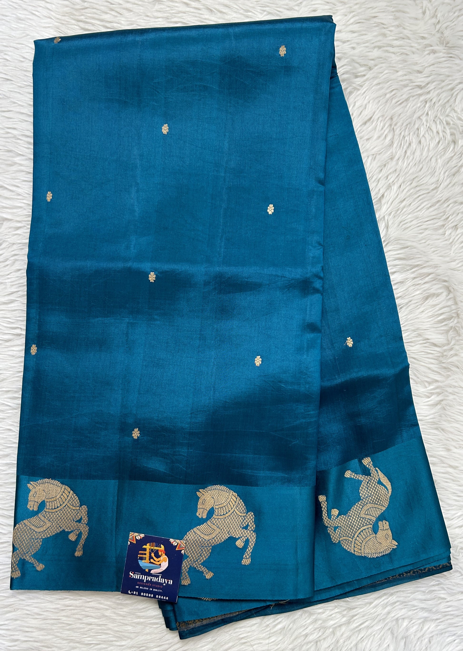 Raw Mango or Pooniya Silk Saree Peacock Blue Colored Complemented With a Mashru Border - Sampradaya Designer Studio