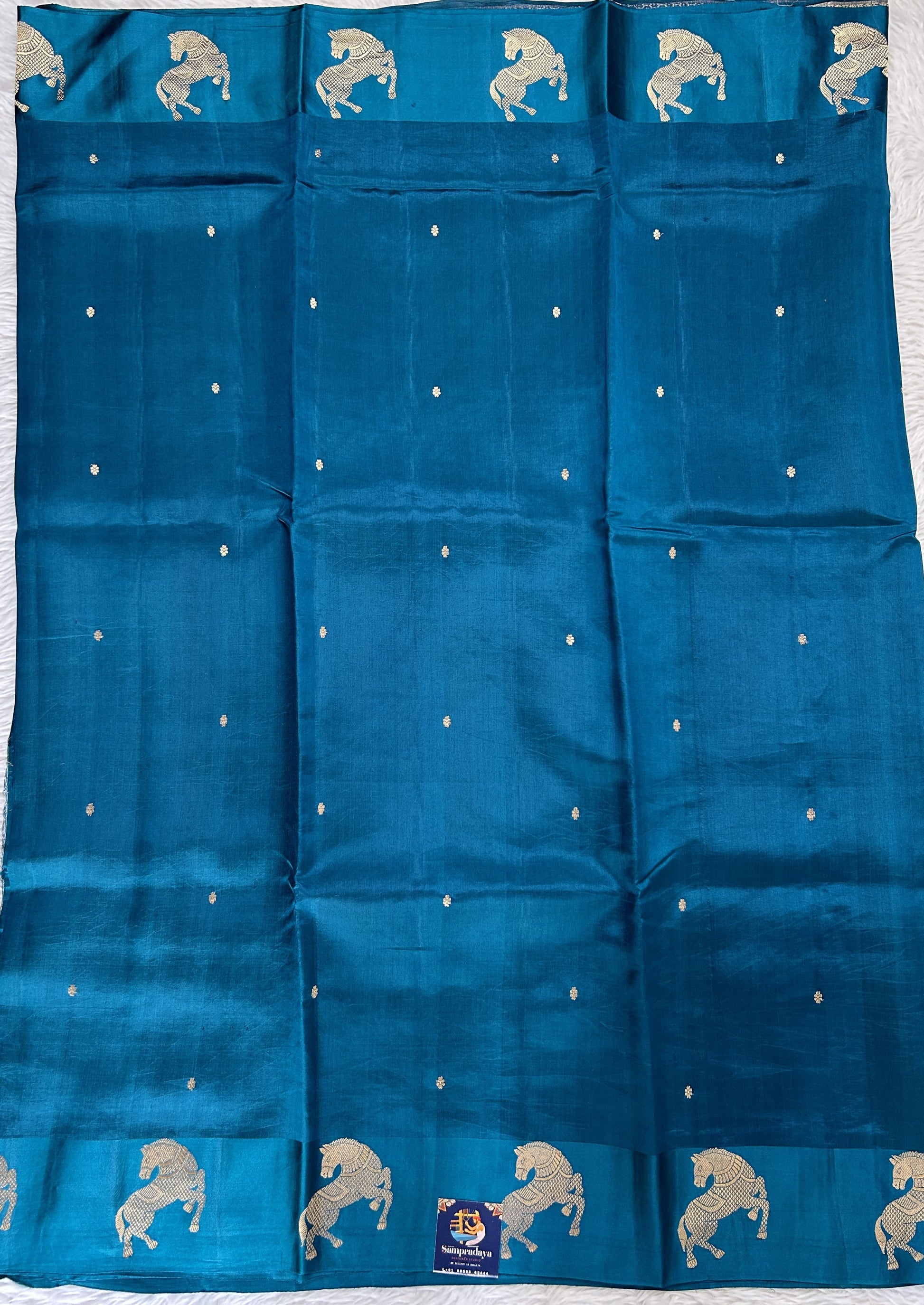 Raw Mango or Pooniya Silk Saree Peacock Blue Colored Complemented With a Mashru Border - Sampradaya Designer Studio