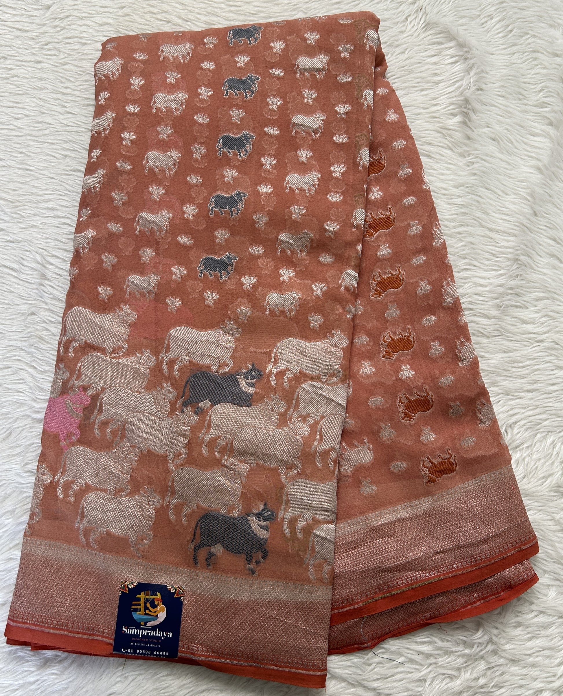 Banarasi Georgette Saree Peach Colored Complemented with a Zari Border. - Sampradaya Designer Studio