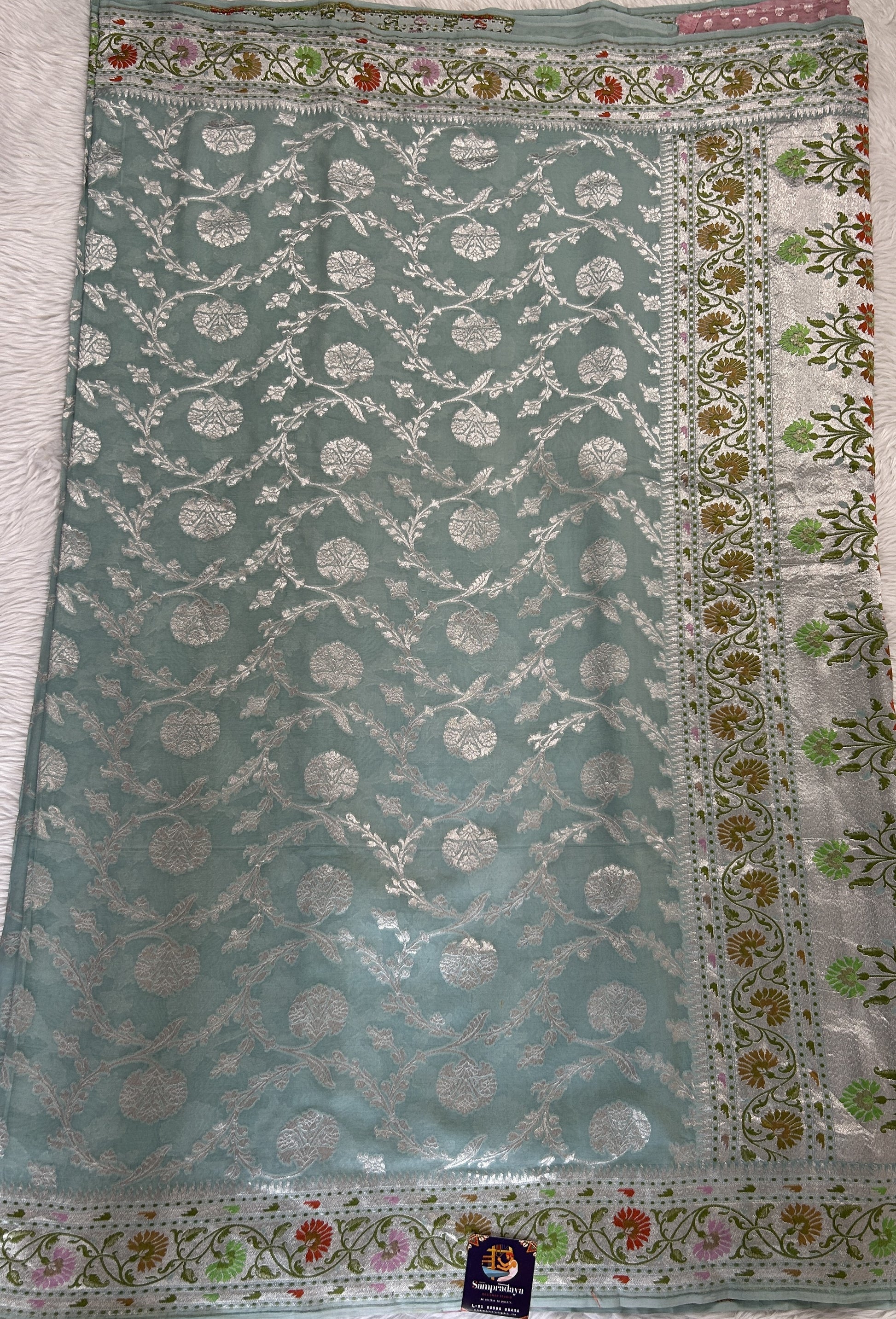 Banarasi Georgette Saree Sea Blue Colored Complemented with a Zari Border. - Sampradaya Designer Studio