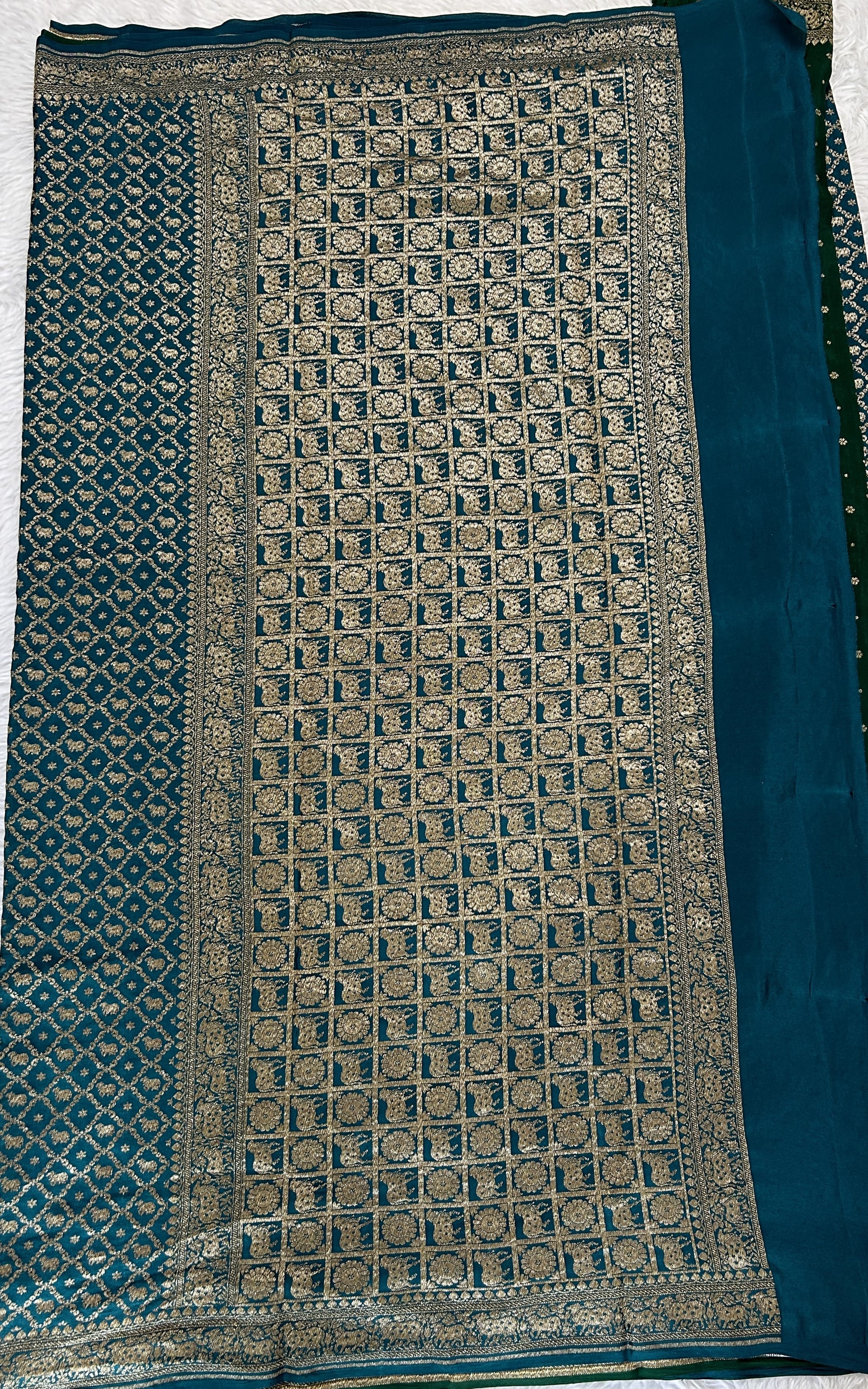 Banarasi Georgette Saree Peacock Blue Colored Complemented with a Zari Border. - Sampradaya Designer Studio