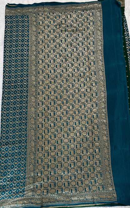 Banarasi Georgette Saree Peacock Blue Colored Complemented with a Zari Border. - Sampradaya Designer Studio