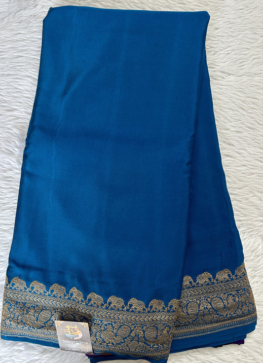 Banarasi Georgette Saree Peacock Blue Colored Complemented with a Zari Border. - Sampradaya Designer Studio