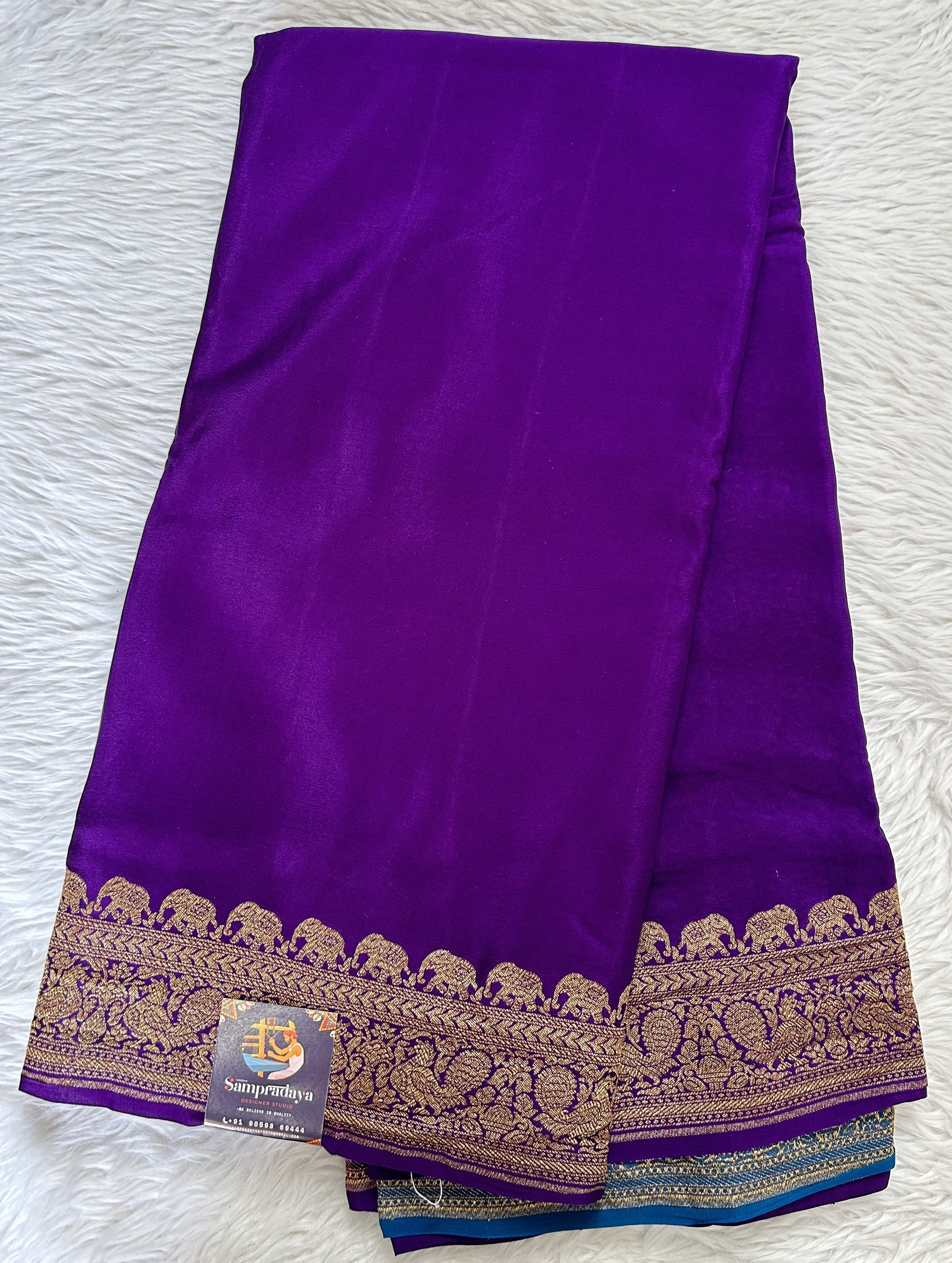 Banarasi Georgette Saree Purple Colored Complemented with a Zari Border. - Sampradaya Designer Studio