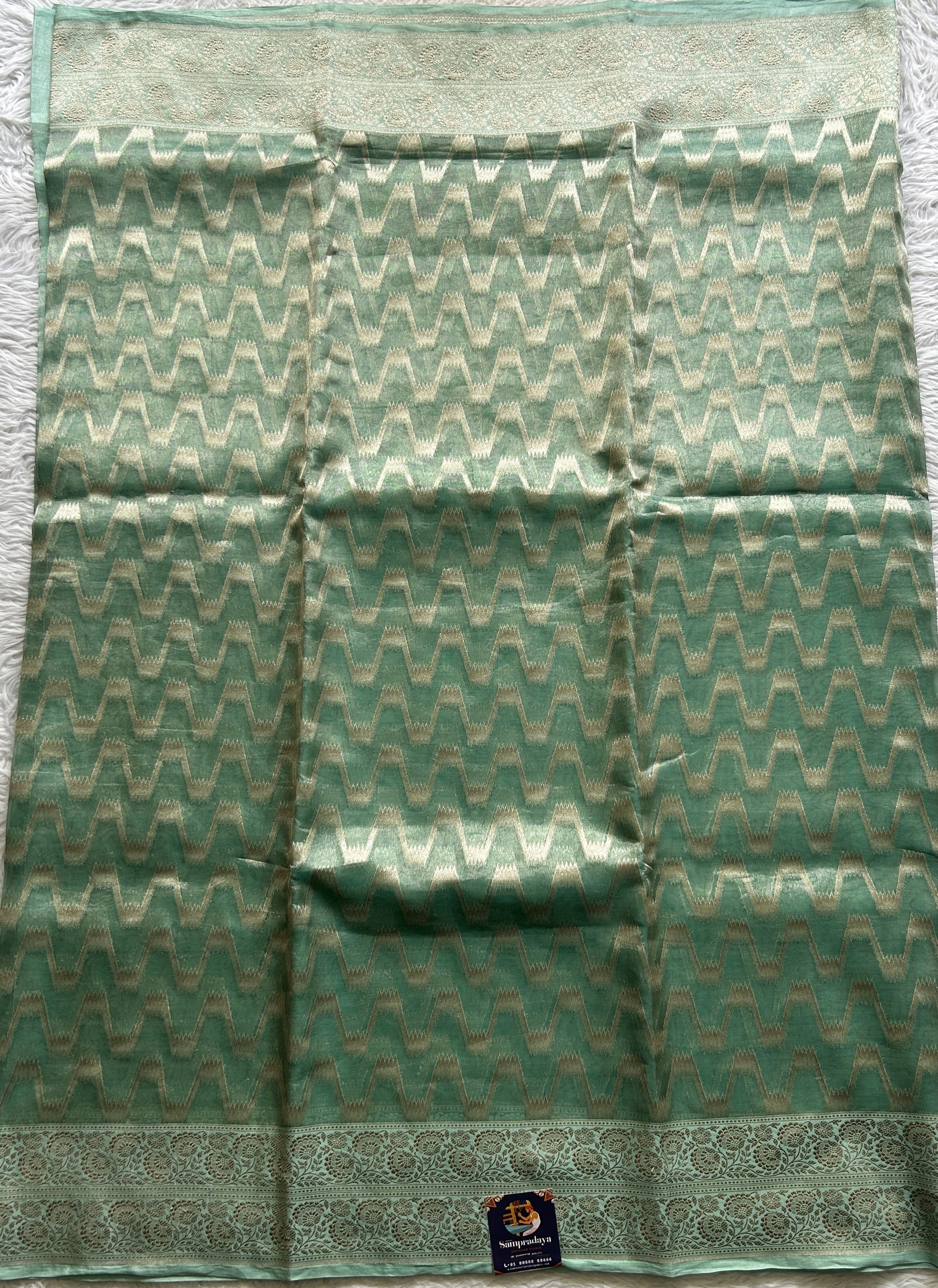 Banarasi Kora Tissue Saree Sea Green Colored Complemented with a Zari Border. - Sampradaya Designer Studio