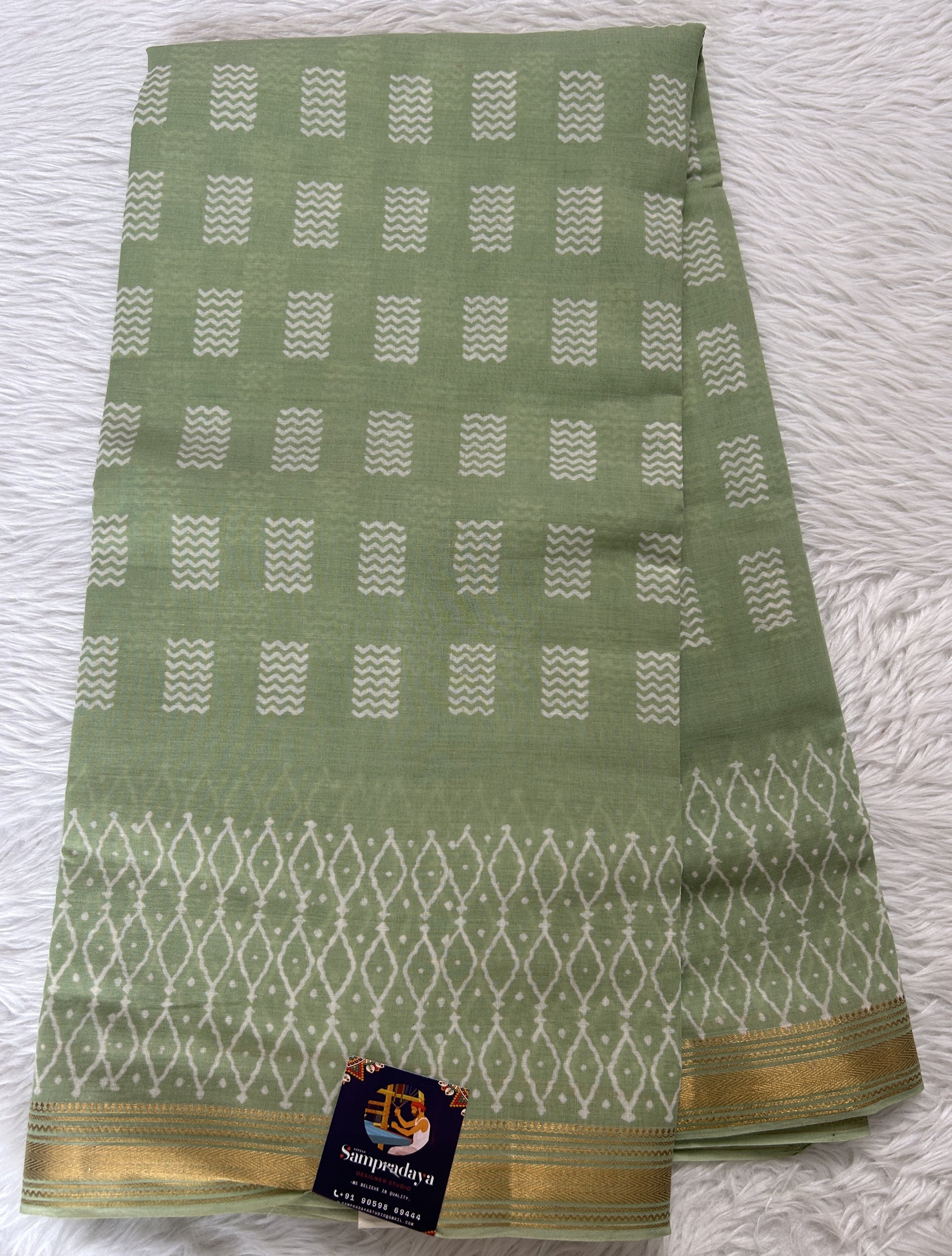 Banarasi Cotton Saree Parrot Green Colored Complemented with a Zari Border. - Sampradaya Designer Studio