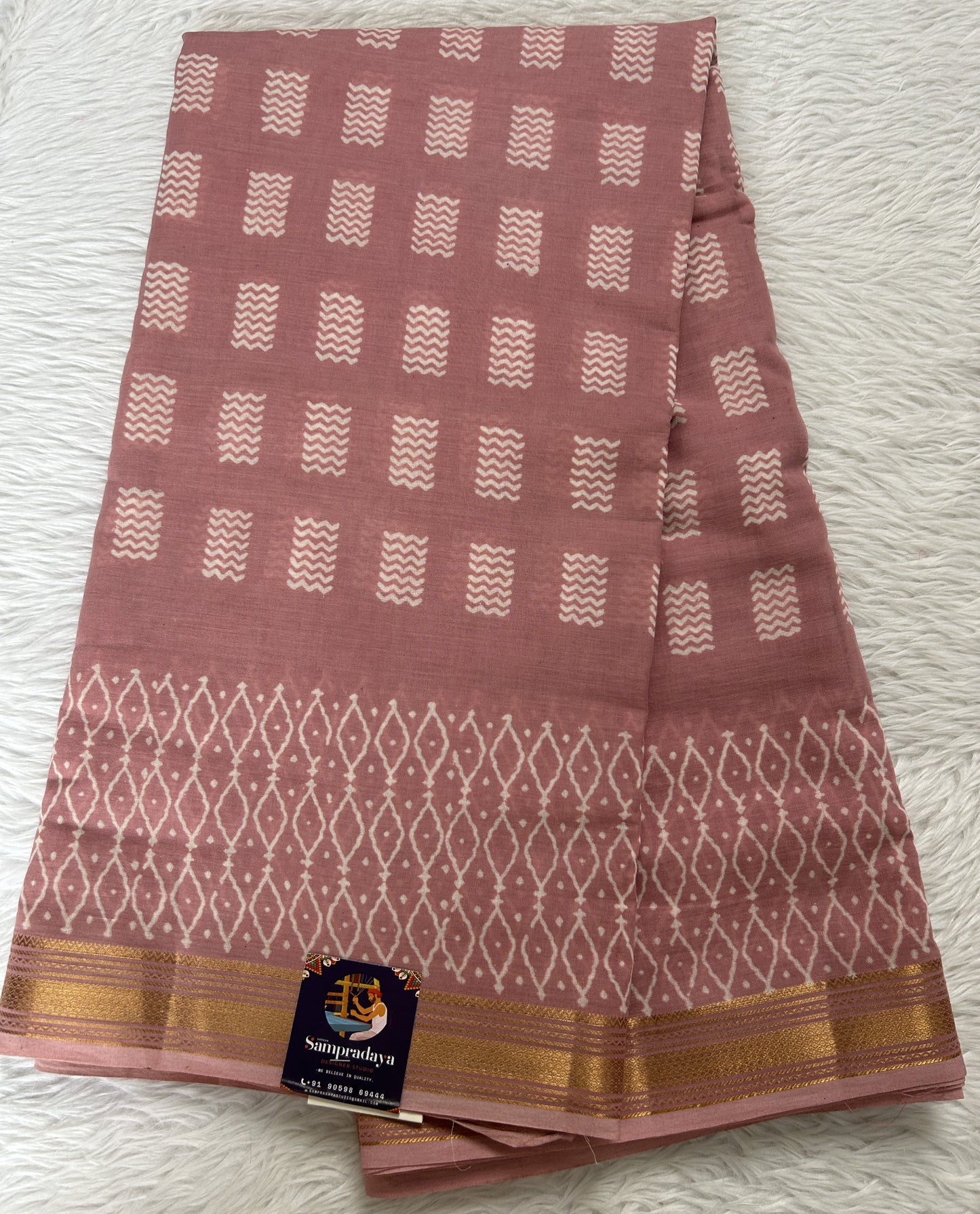 Banarasi Cotton Saree Peach Colored Complemented with a Zari Border. - Sampradaya Designer Studio