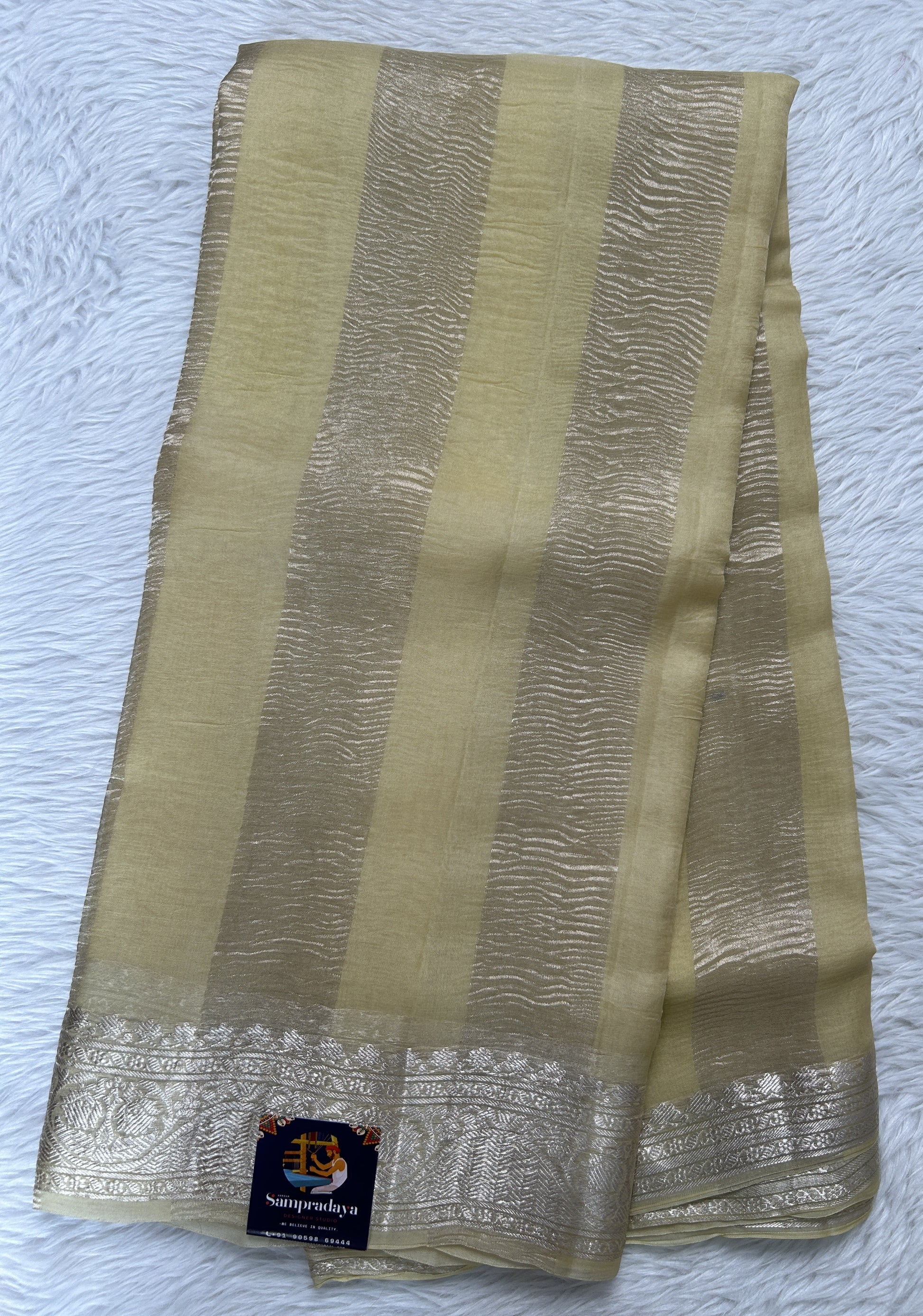 Banarasi Crushed Silk Saree Pastel Yellow Colored Complemented with a Zari border. - Sampradaya Designer Studio