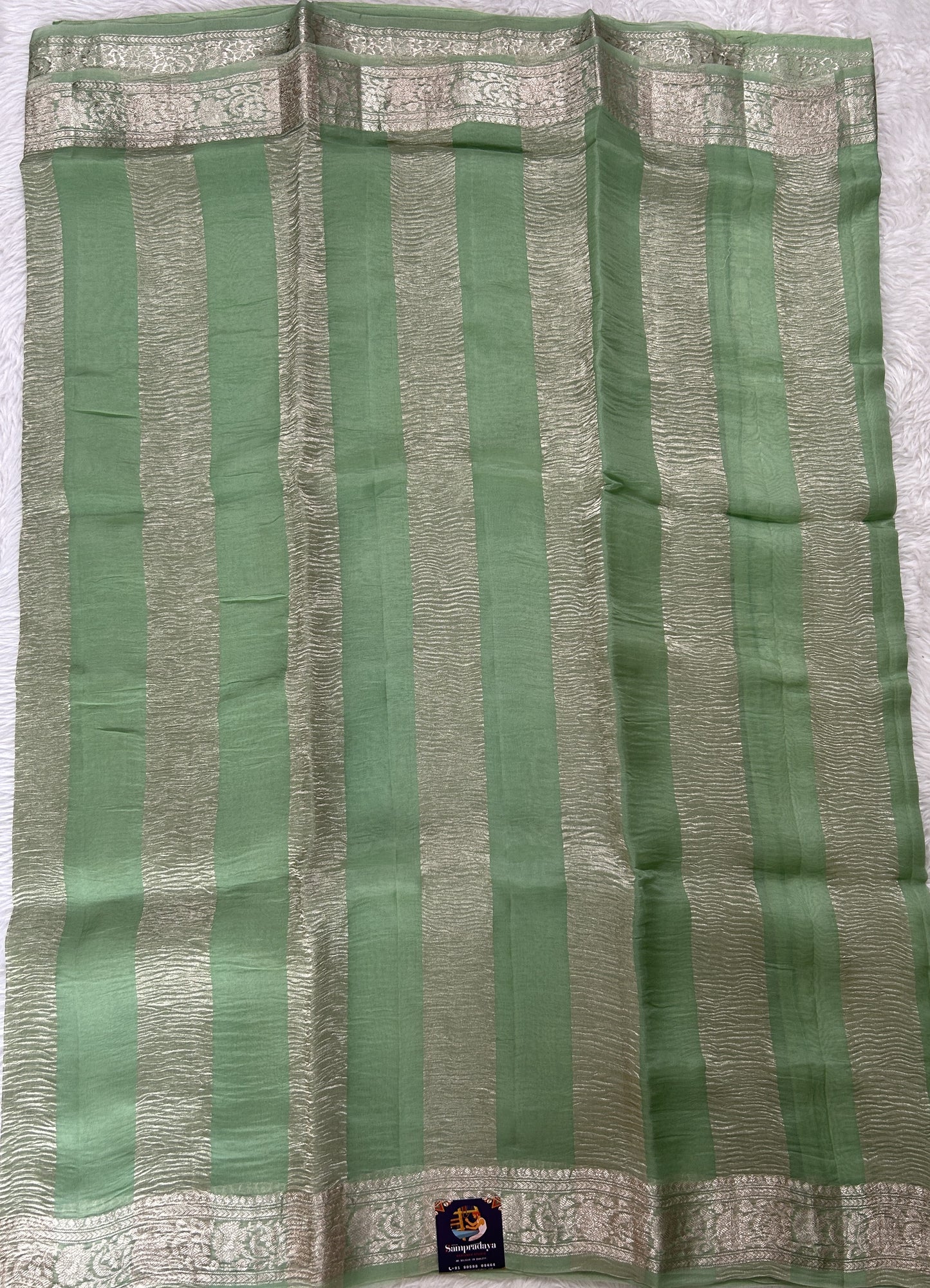 Banarasi Crushed Silk Saree Pastel Green Colored Complemented with a Zari border. - Sampradaya Designer Studio