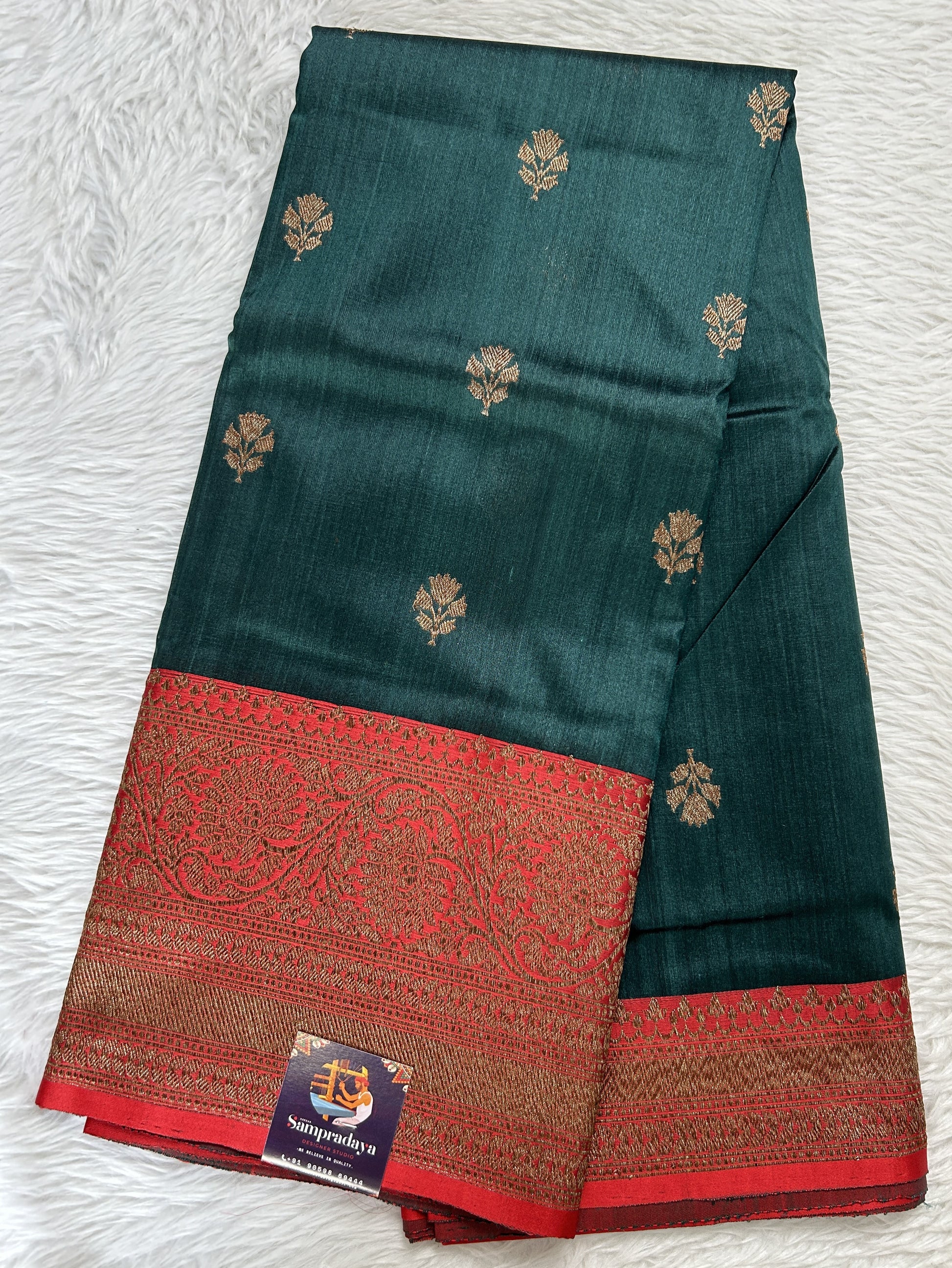 Dupion Silk Saree Bottle Green Colored Complemented with a Red Color Zari Border. - Sampradaya Designer Studio