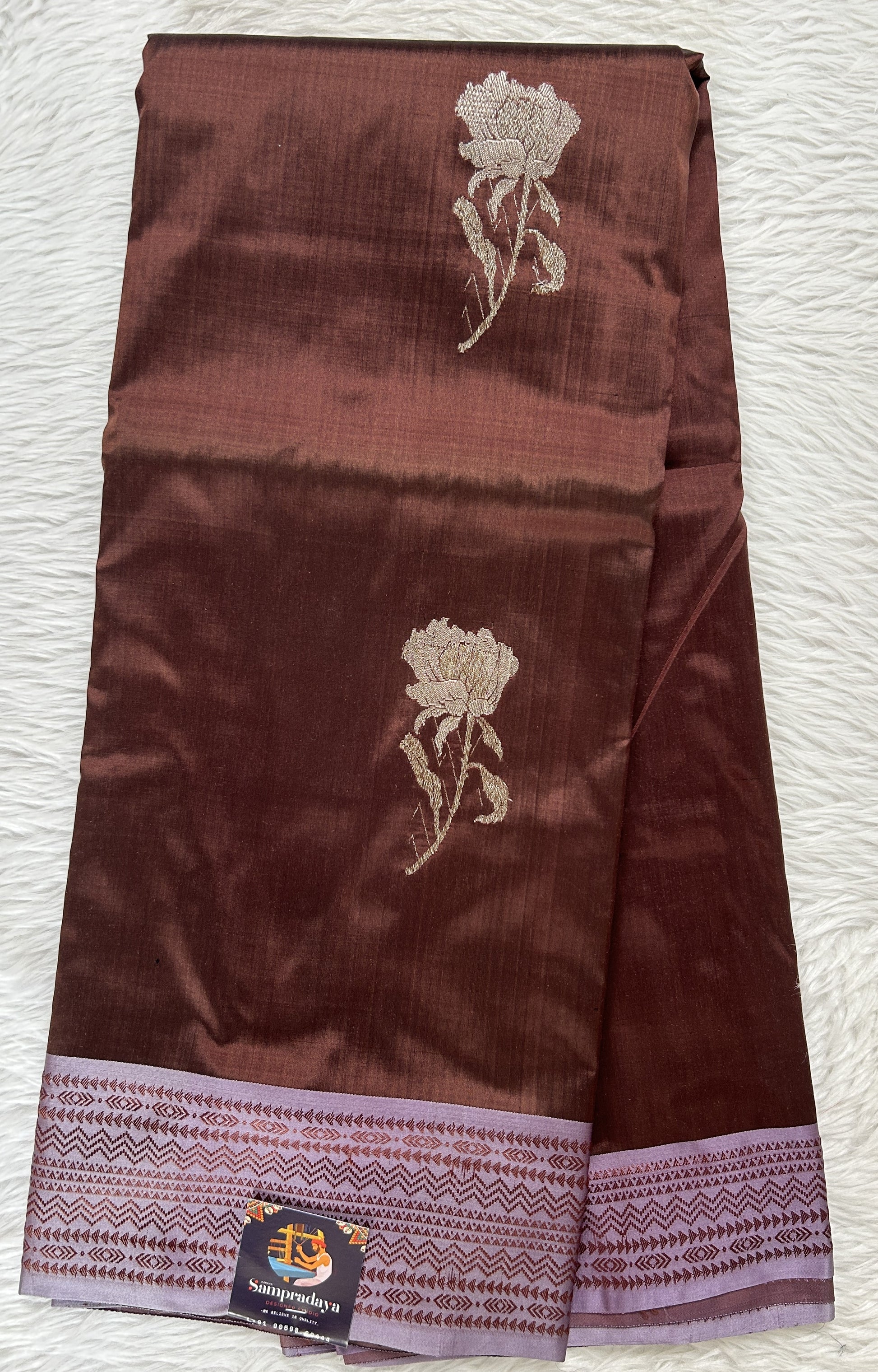 Banarasi Katan Silk Saree Brown Colored Complemented with a Lilac Color Zari border. - Sampradaya Designer Studio