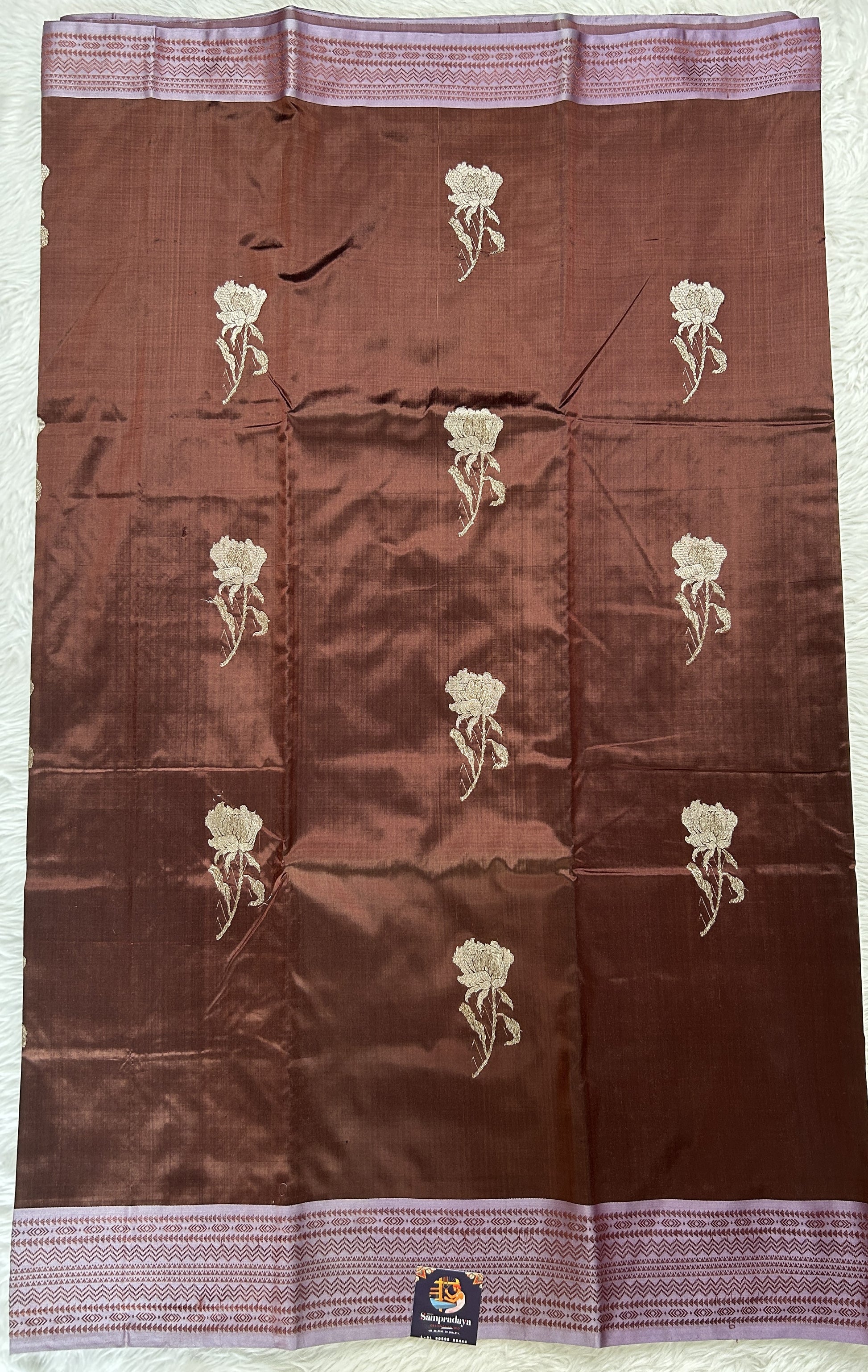 Banarasi Katan Silk Saree Brown Colored Complemented with a Lilac Color Zari border. - Sampradaya Designer Studio