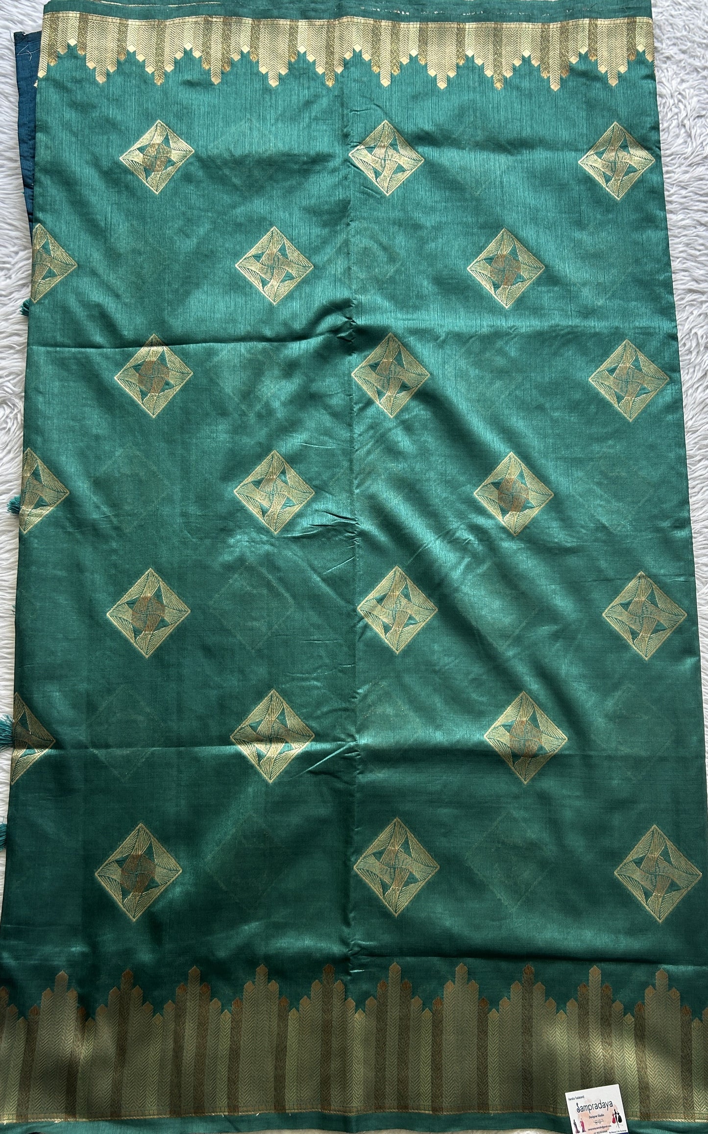 Semi Raw Silk Saree Turquoise Green Colored Complemented with a Zari Border. - Sampradaya Designer Studio