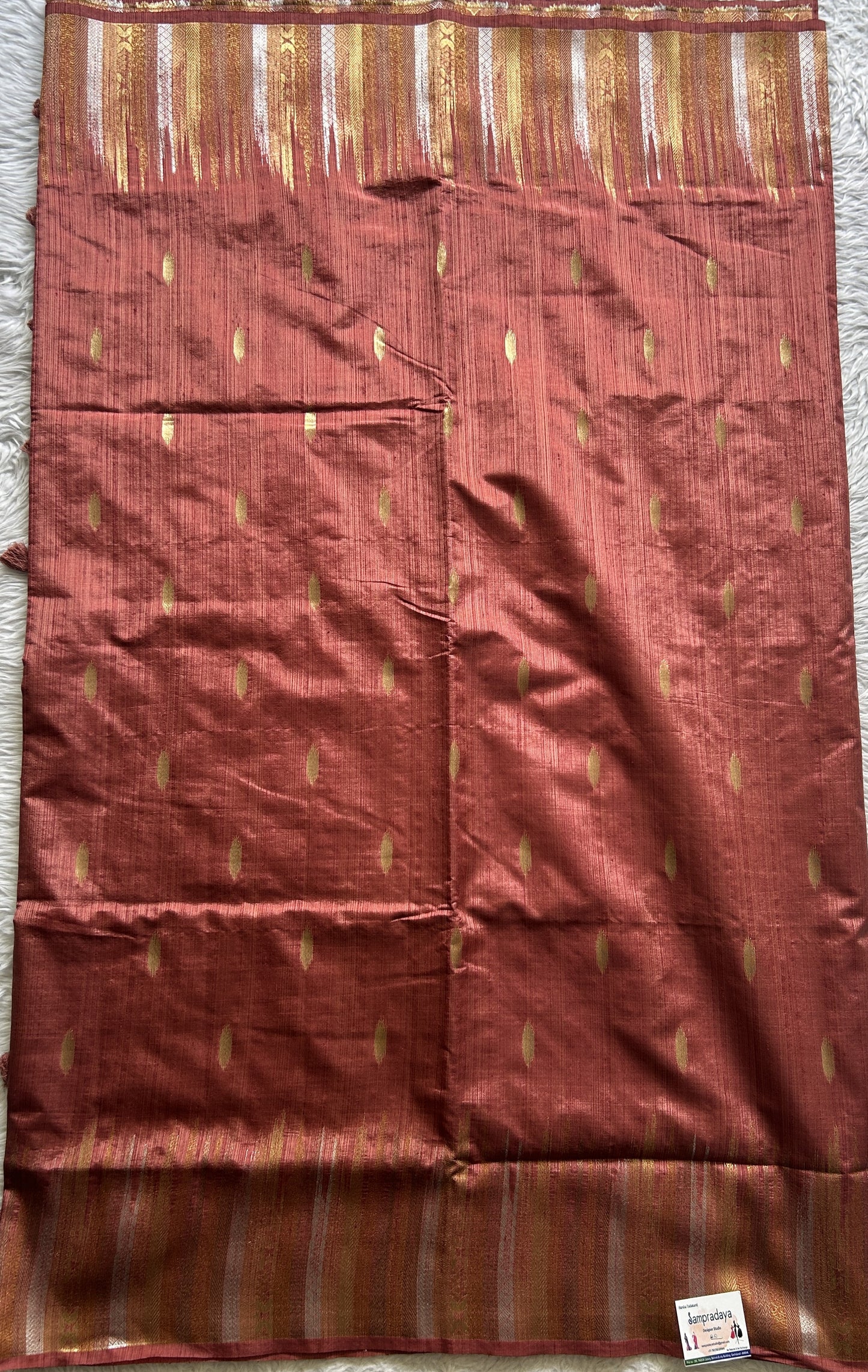 Semi Raw Silk Saree Rust Colored Complemented with a Zari Border. - Sampradaya Designer Studio