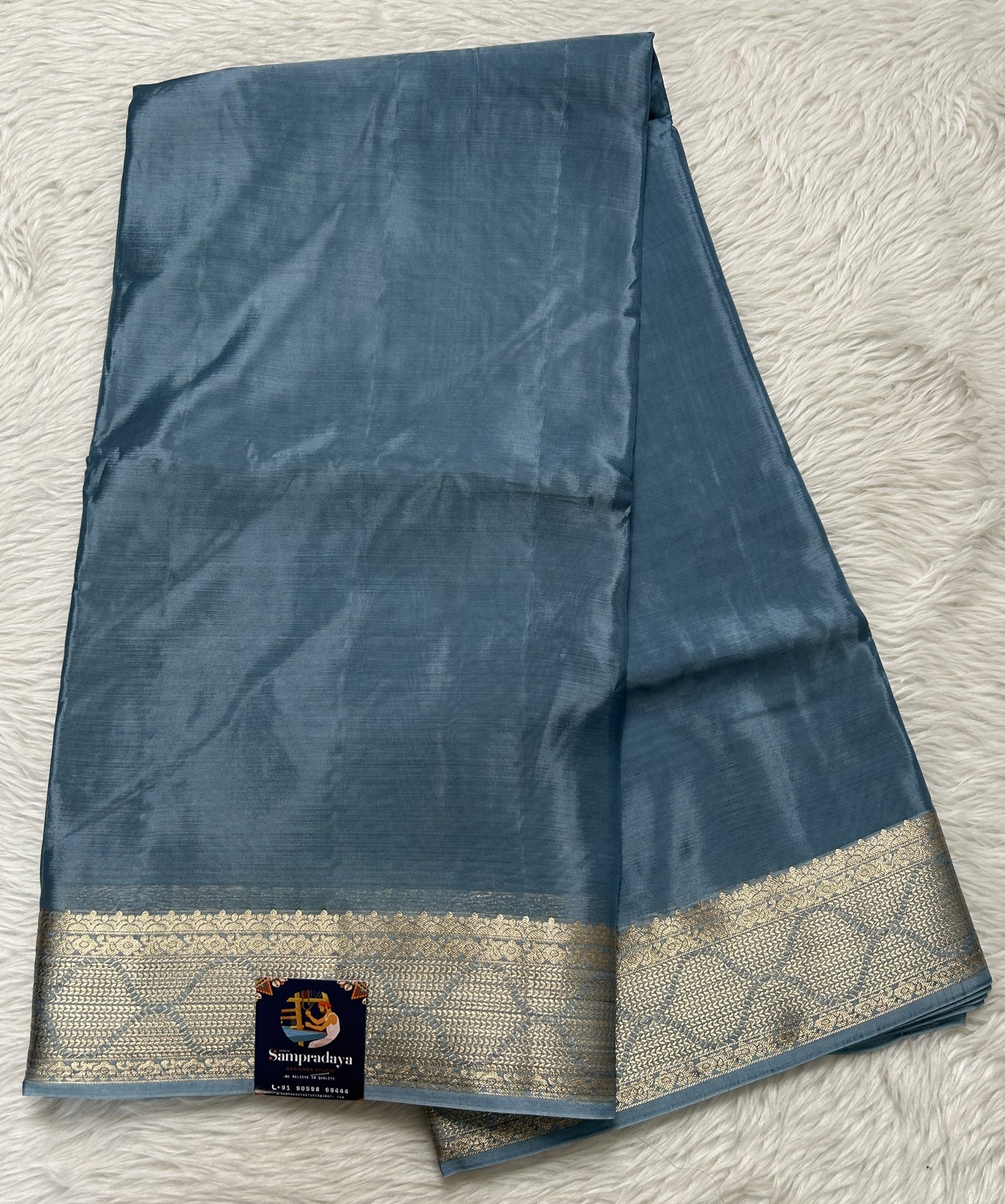 Satin Georgette Saree Sea Blue Colored Complemented with a Zari Border. - Sampradaya Designer Studio