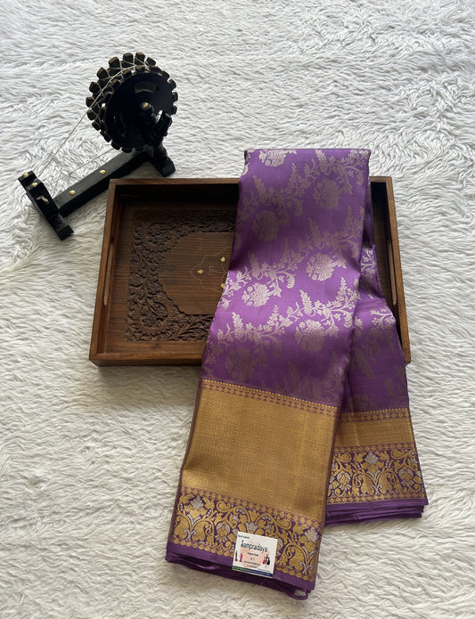 Kanjivaram Bridal Silk Saree Lavender colored Saree complemented with a Zari border.