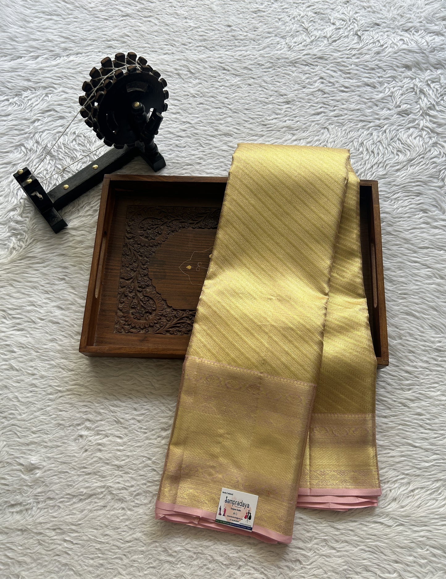 Kanjivaram Bridal Silk Saree Gold colored Saree complemented with a Zari border.