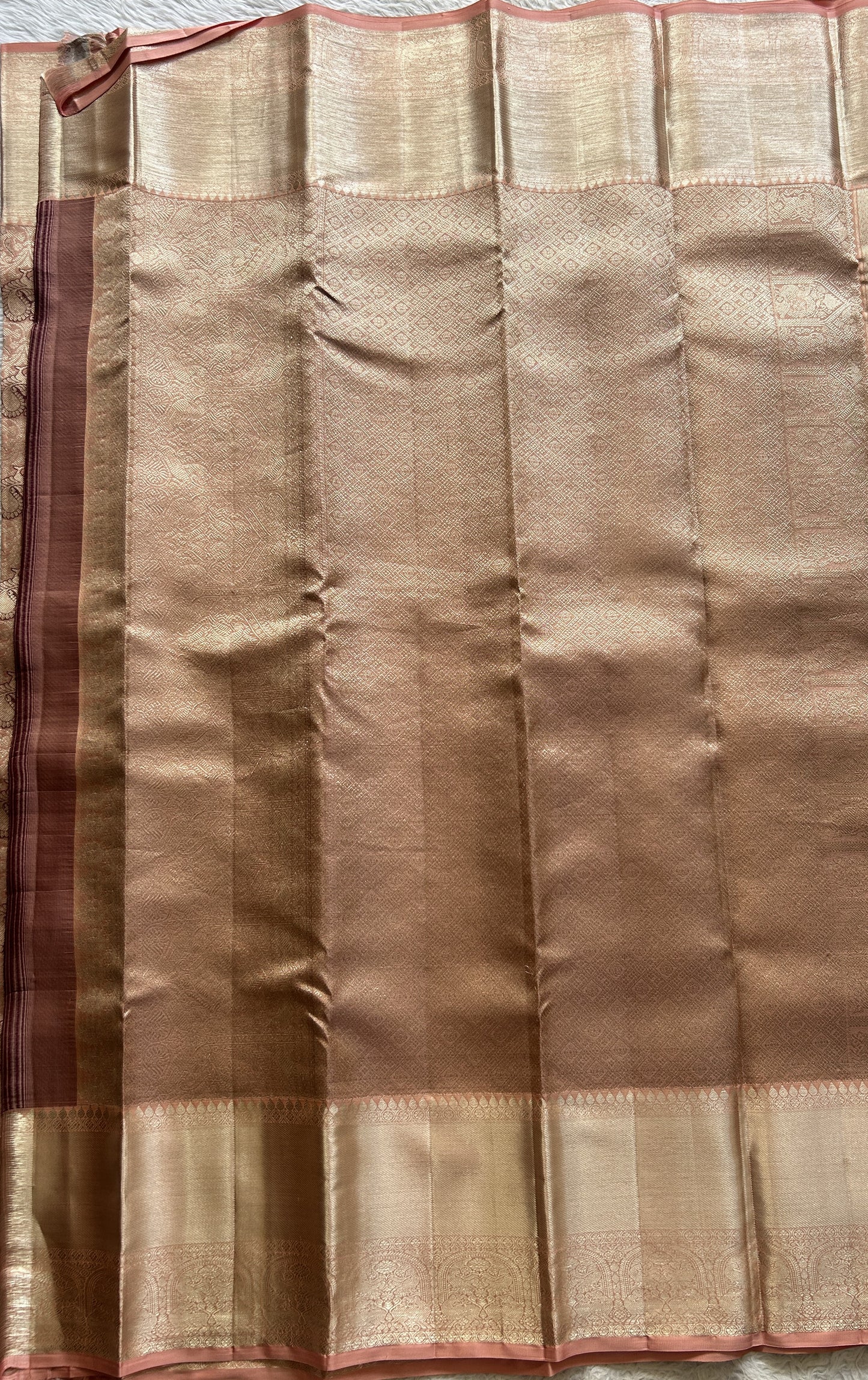 Kanjivaram Bridal Silk Saree Pale Orange colored Saree complemented with a Zari border.