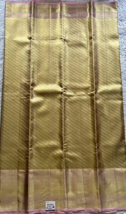 Kanjivaram Bridal Silk Saree Gold colored Saree complemented with a Zari border.