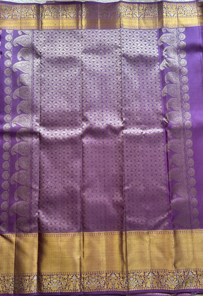 Kanjivaram Bridal Silk Saree Lavender colored Saree complemented with a Zari border.