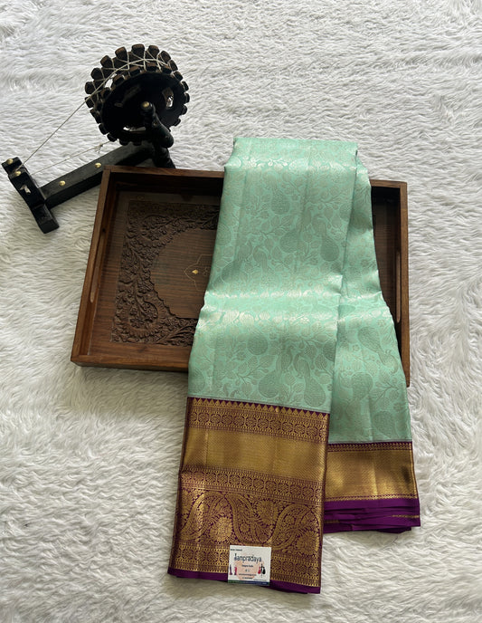 Kanjivaram Bridal Silk Saree Aqua Blue colored complemented with a Zari border.