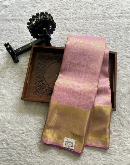 Kanjivaram Bridal Silk Saree Light Pink colored complemented with a Zari border.