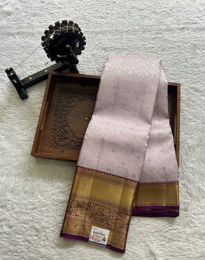 Kanjivaram Bridal Silk Saree Light Lilac colored complemented with a Zari border.