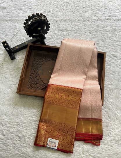 Kanjivaram Bridal Silk Saree Light Peach colored complemented with a Zari border.