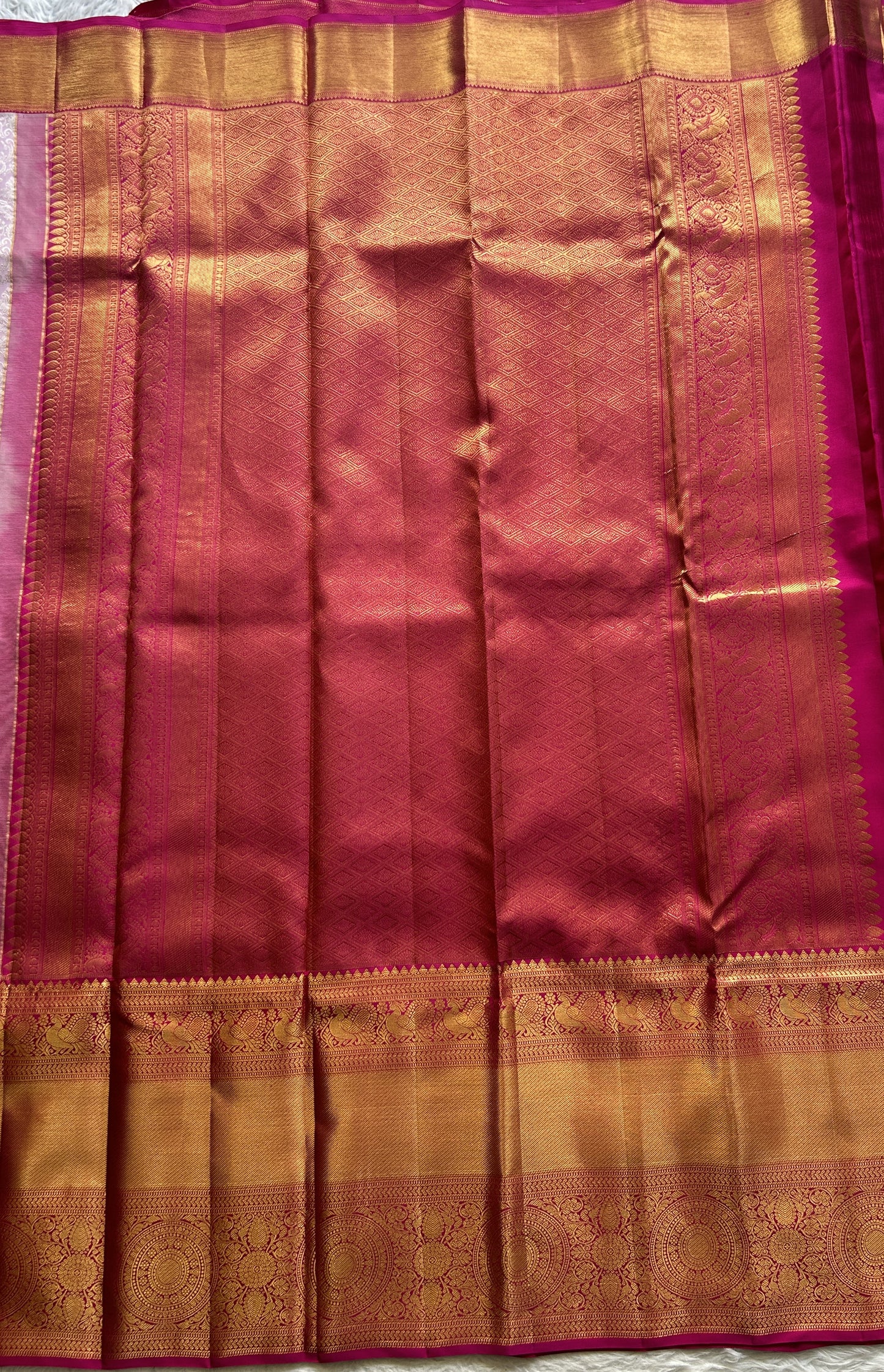 Kanjivaram Bridal Silk Saree Baby Pink colored complemented with a Zari border.