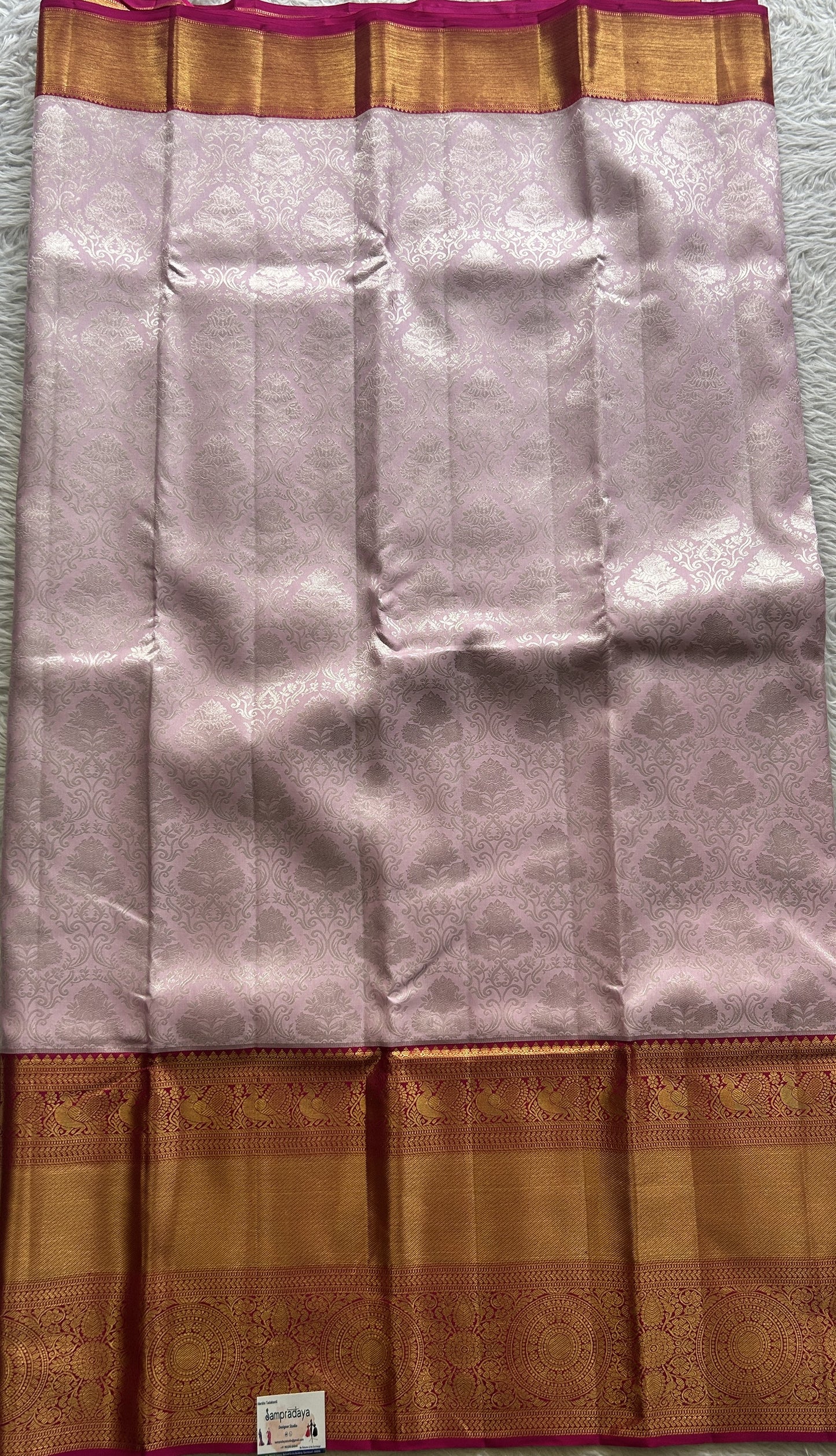 Kanjivaram Bridal Silk Saree Baby Pink colored complemented with a Zari border.