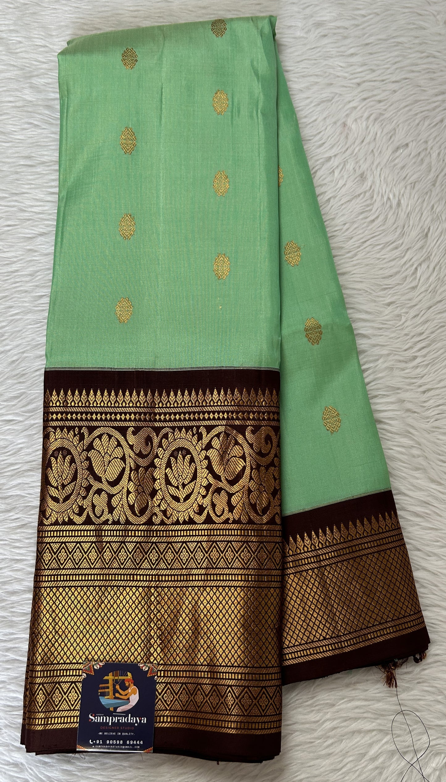 Gadwal Pattu Green Colored Saree Complemented With a Brown Color Kanchi Border - Sampradaya Designer Studio