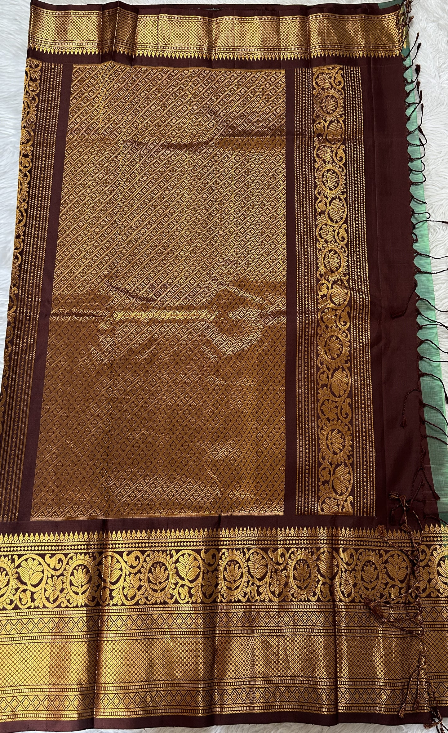 Gadwal Pattu Green Colored Saree Complemented With a Brown Color Kanchi Border - Sampradaya Designer Studio