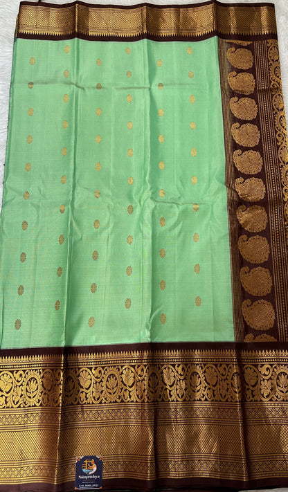 Gadwal Pattu Green Colored Saree Complemented With a Brown Color Kanchi Border - Sampradaya Designer Studio