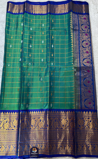 Gadwal Pattu Saree Green Colored Complemented With a Ink Blue Color Kanchi Border - Sampradaya Designer Studio