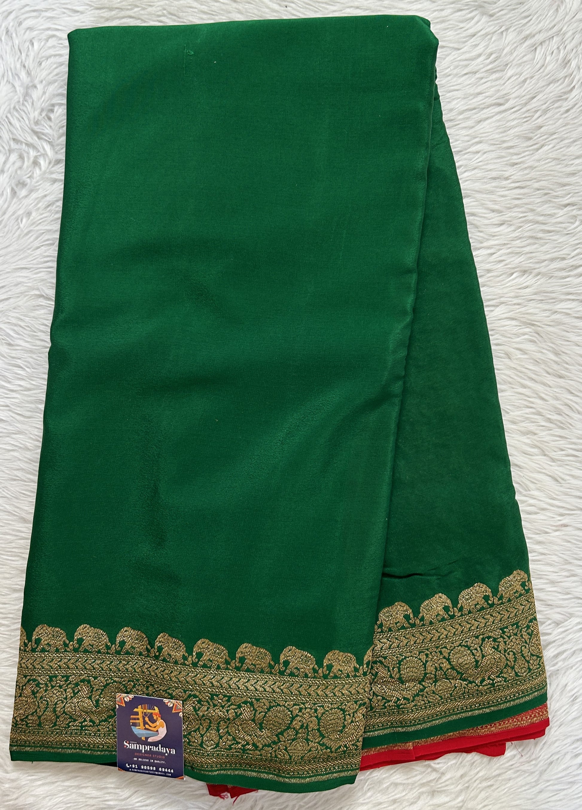 Banarasi Georgette Saree Bottle Green Colored Complemented with a Zari border. - Sampradaya Designer Studio