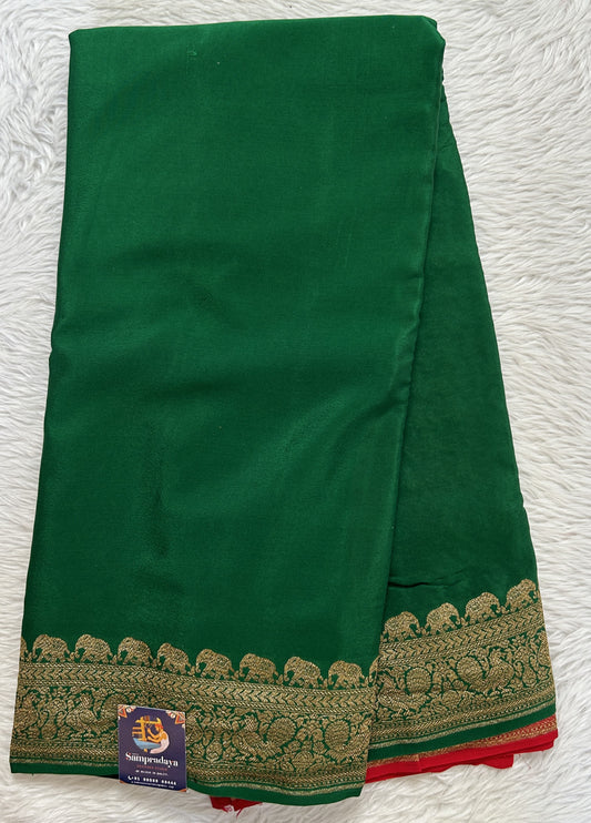 Banarasi Georgette Saree Bottle Green Colored Complemented with a Zari border. - Sampradaya Designer Studio