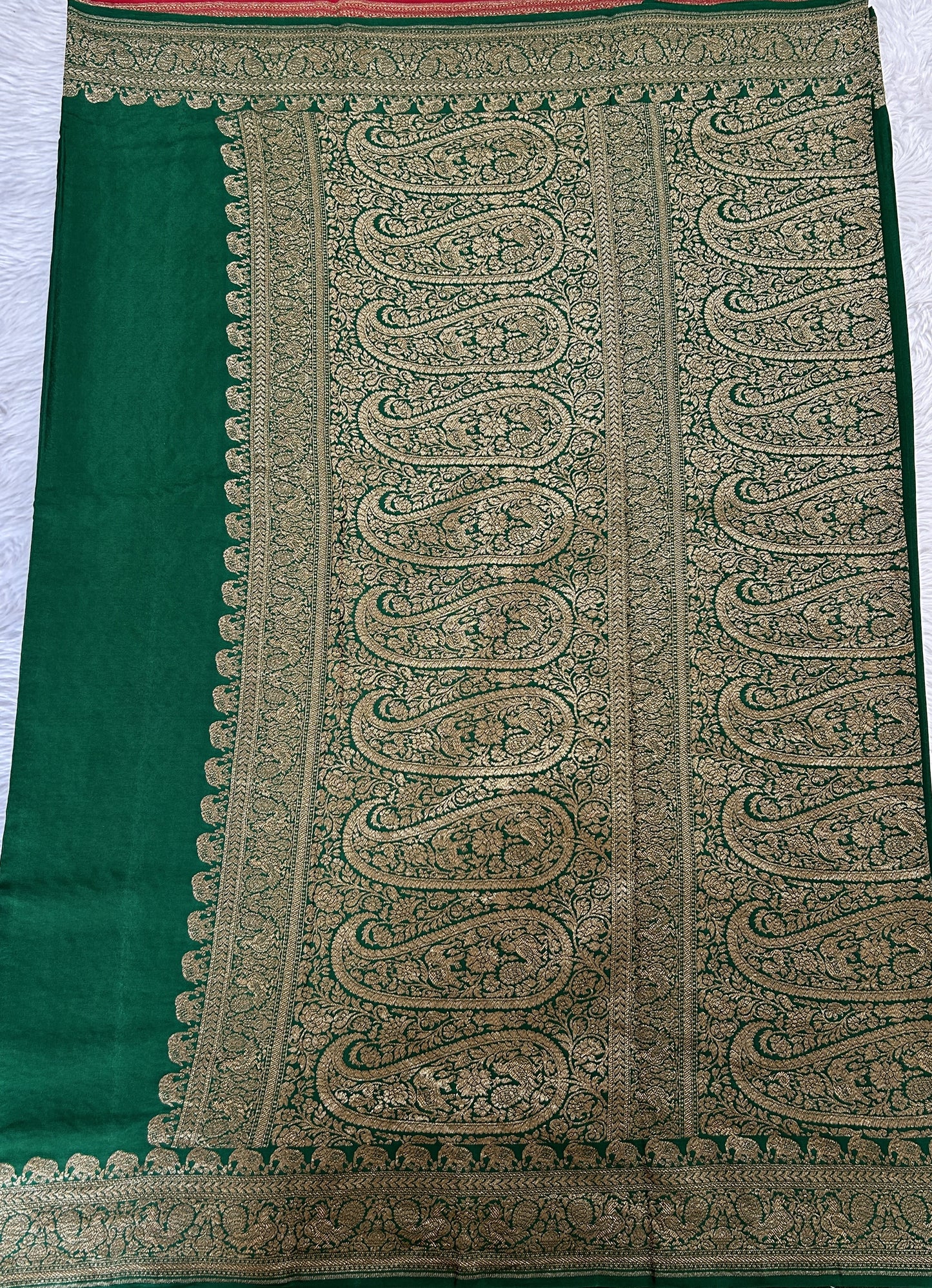 Banarasi Georgette Saree Bottle Green Colored Complemented with a Zari border. - Sampradaya Designer Studio