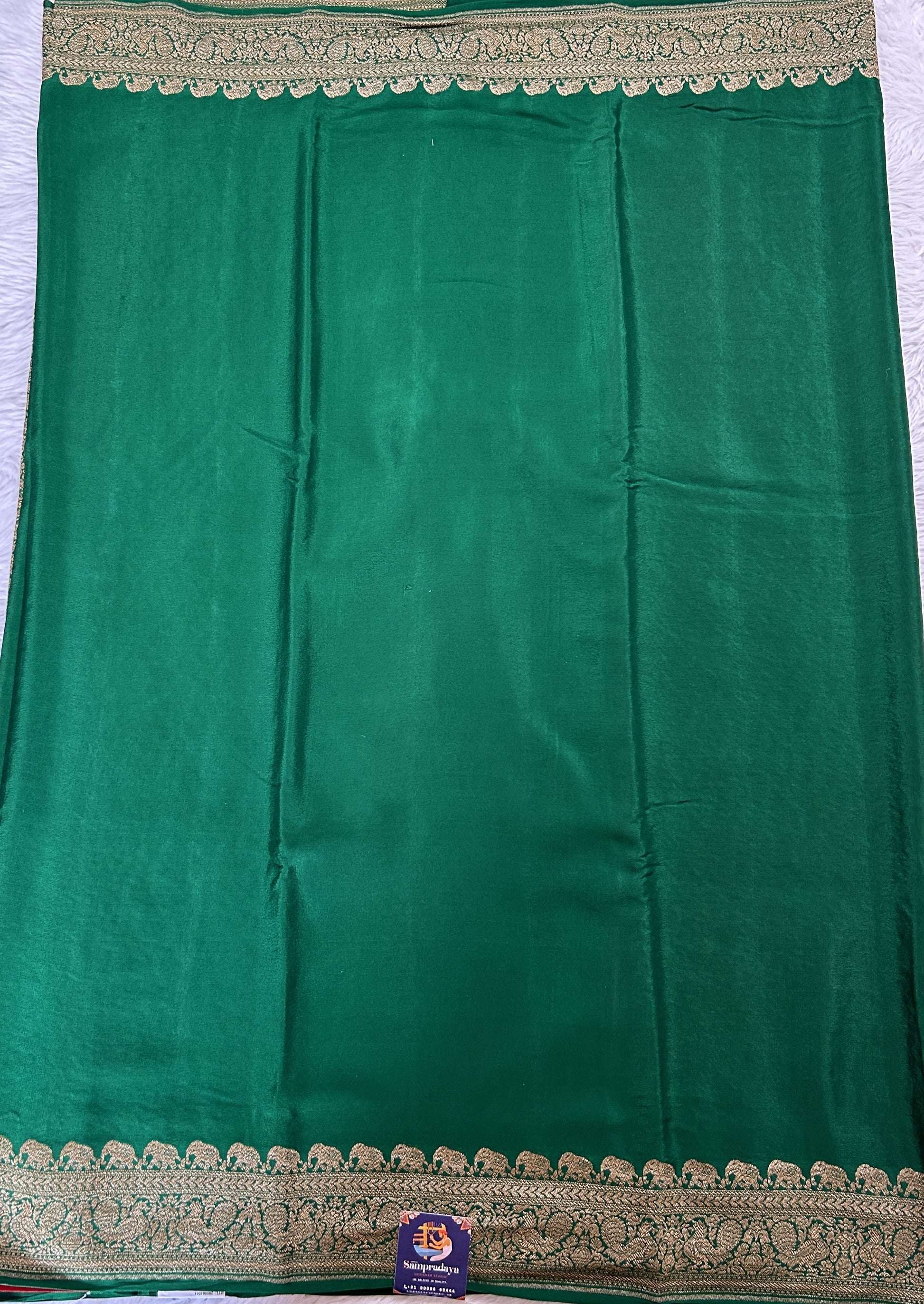 Banarasi Georgette Saree Bottle Green Colored Complemented with a Zari border. - Sampradaya Designer Studio