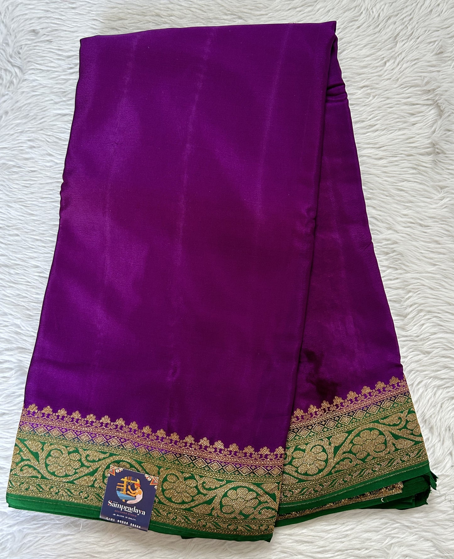 Banarasi Georgette Saree Purple Colored Complemented with a Green Color Zari border. - Sampradaya Designer Studio