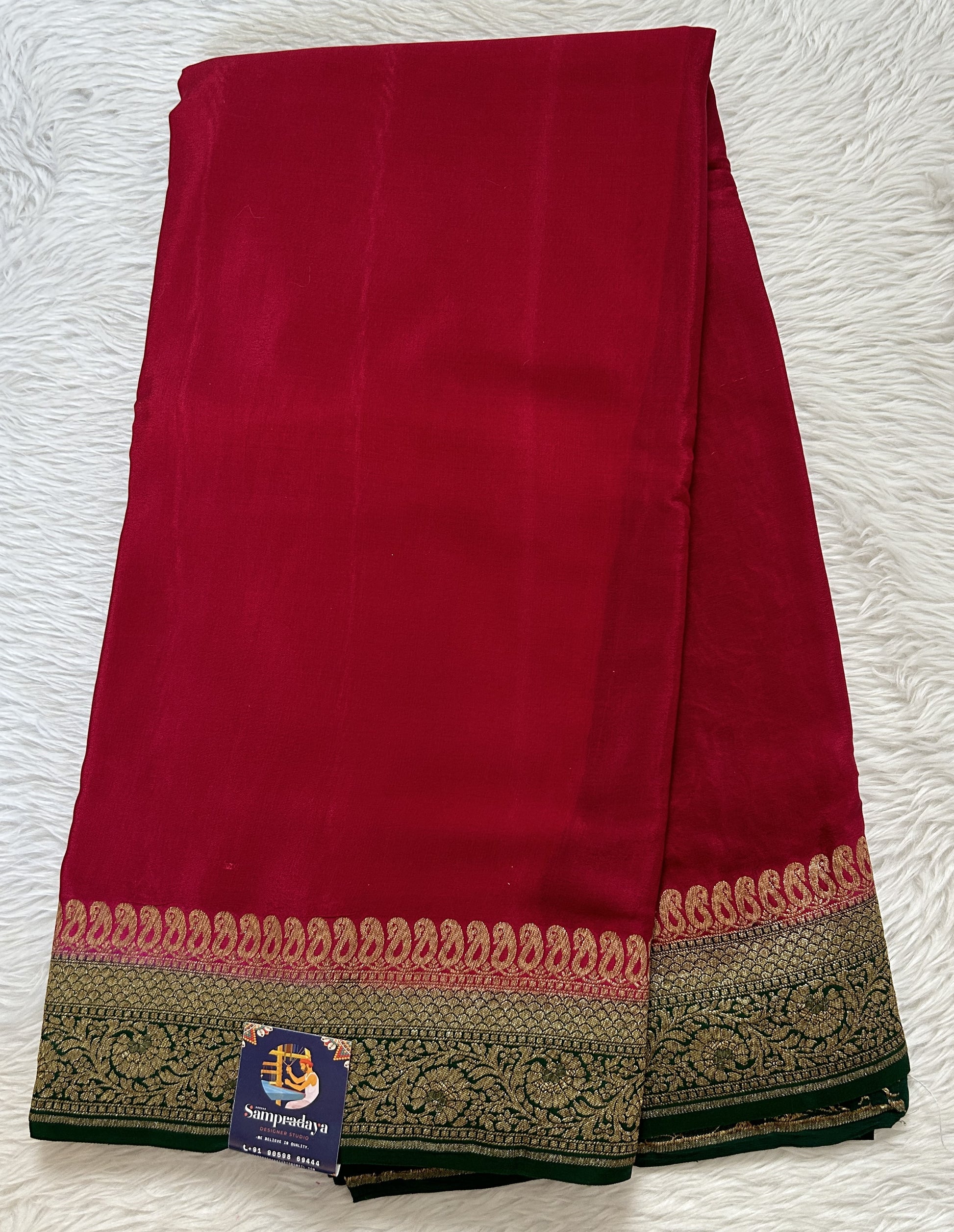 Banarasi Georgette Saree Scarlet Colored Complemented with a Green Color Zari border. - Sampradaya Designer Studio