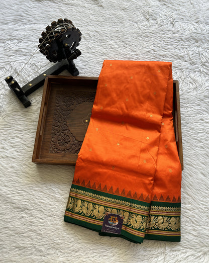 Narayanpet Silk Saree Orange Colored Complemented with a Green Zari Border.