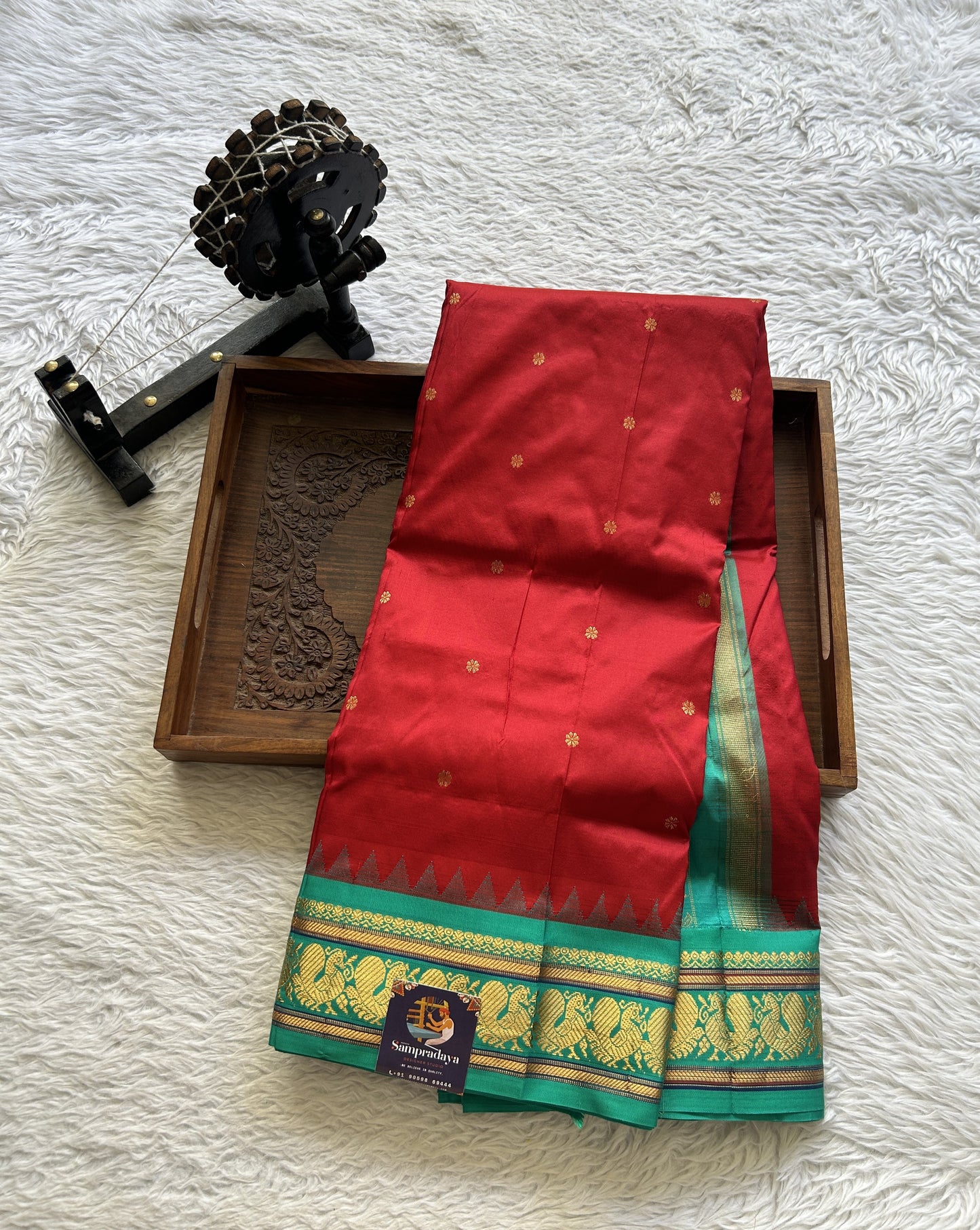 Narayanpet Silk Saree Maroon Colored Complemented with a Rama Green Zari Border.