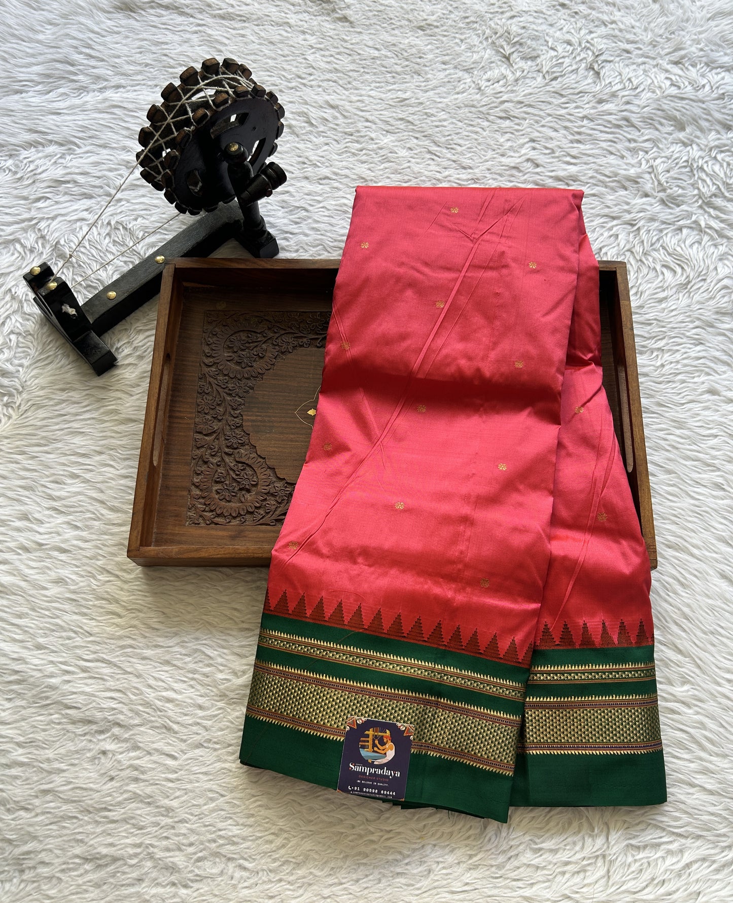 Narayanpet Silk Saree Dark Peach Colored Complemented with a Green Zari Border.